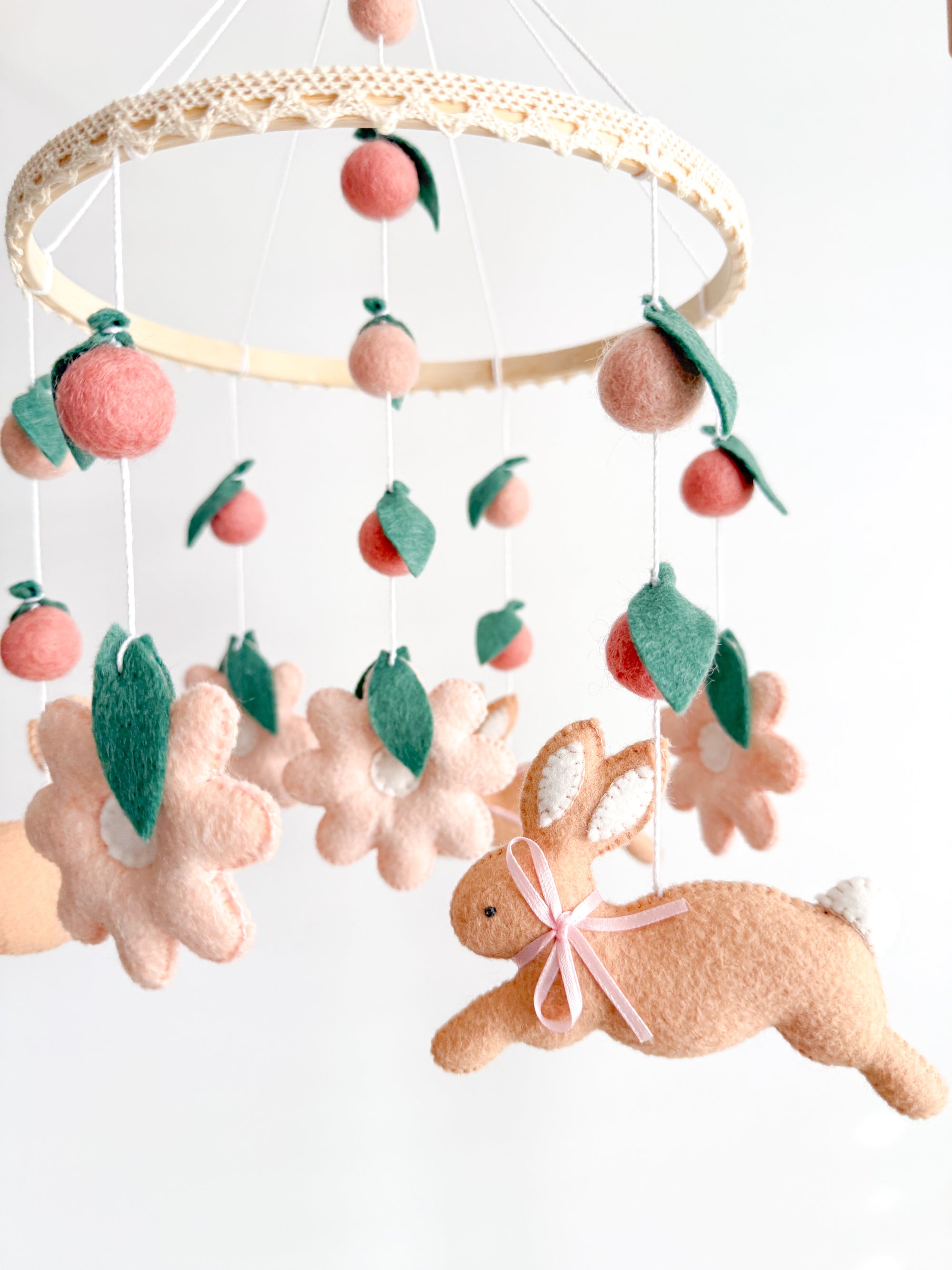 Rabbit mobile with pink flowers