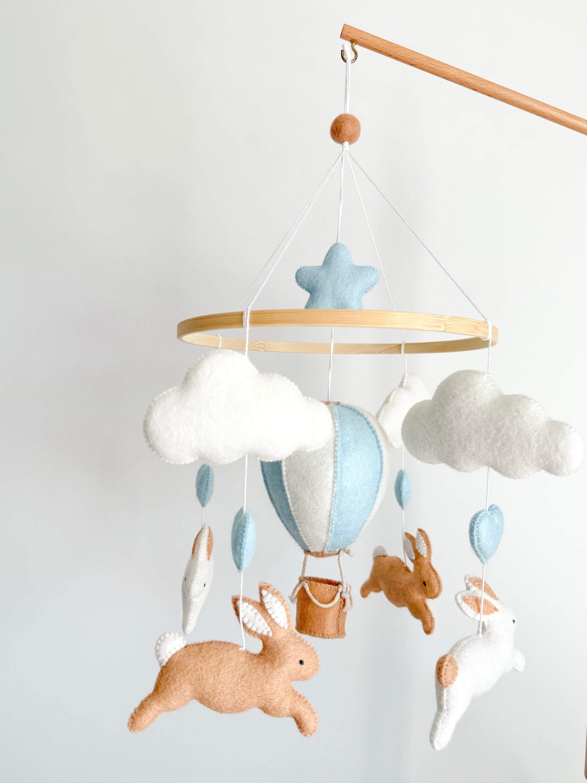 Brown bunny mobile with blue air ballon