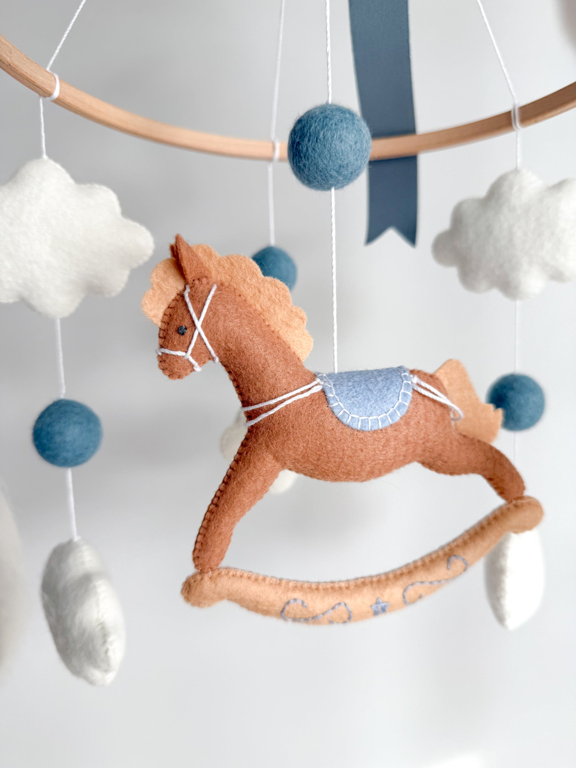 Mobile with a brown rocking horse