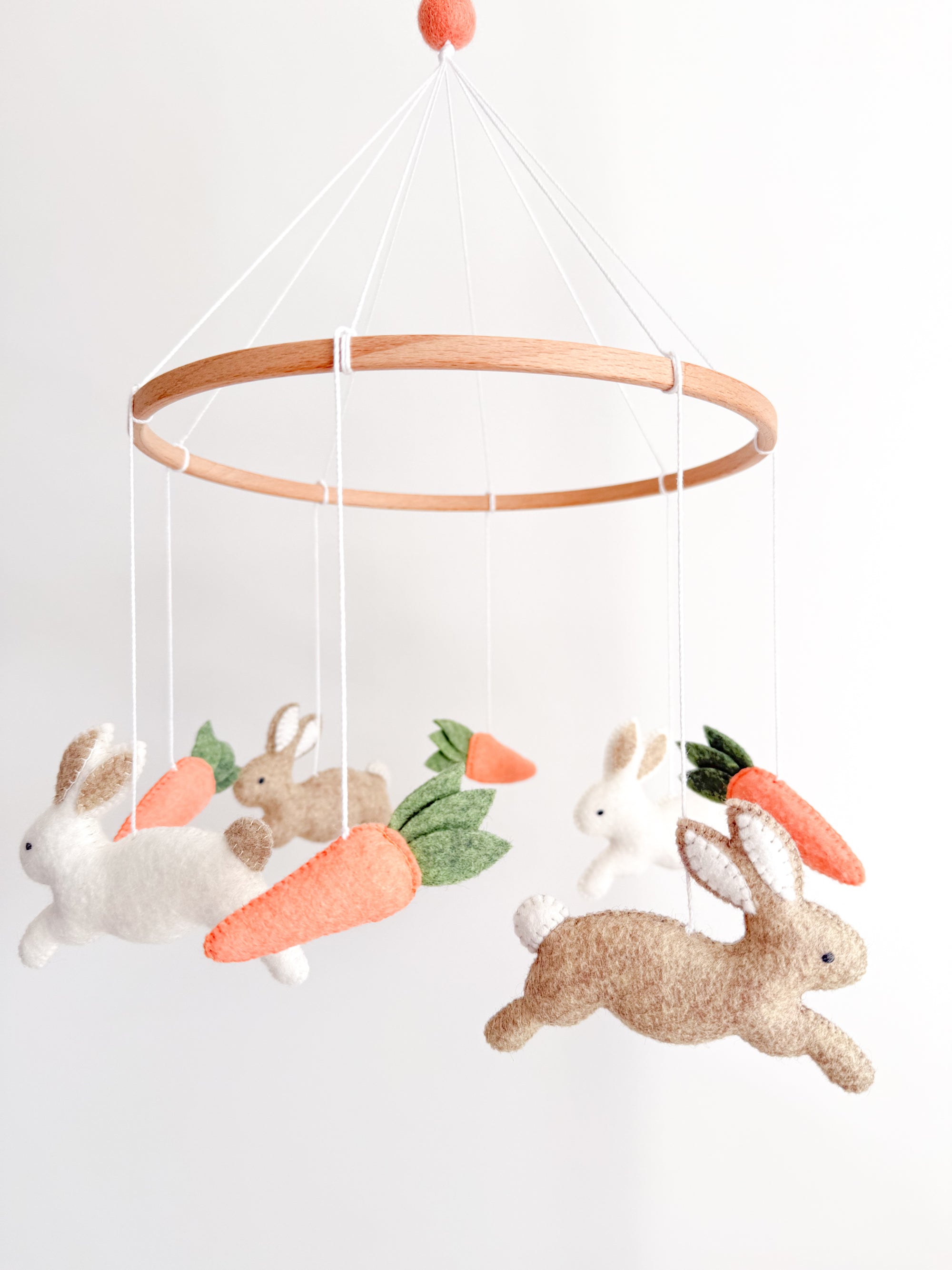 Minimalist bunny mobile with carrots