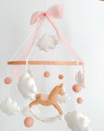 Mobile with a brown rocking horse and pink bow