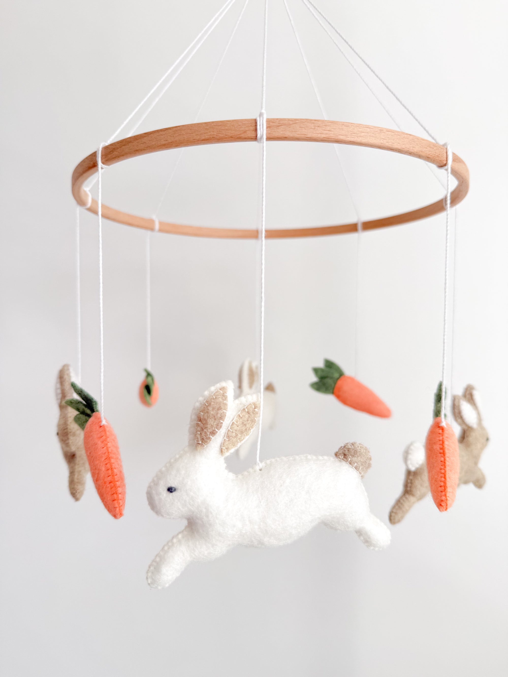 Minimalist bunny mobile with carrots