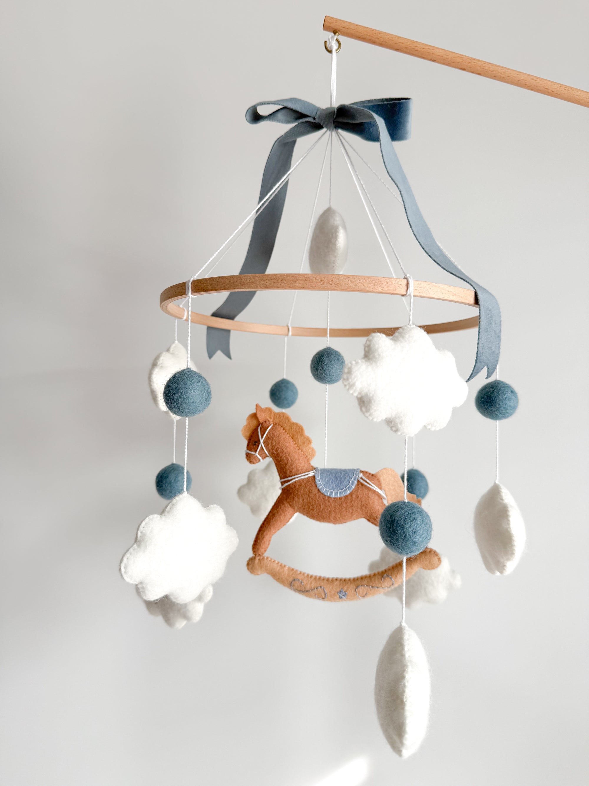 Mobile with a brown rocking horse