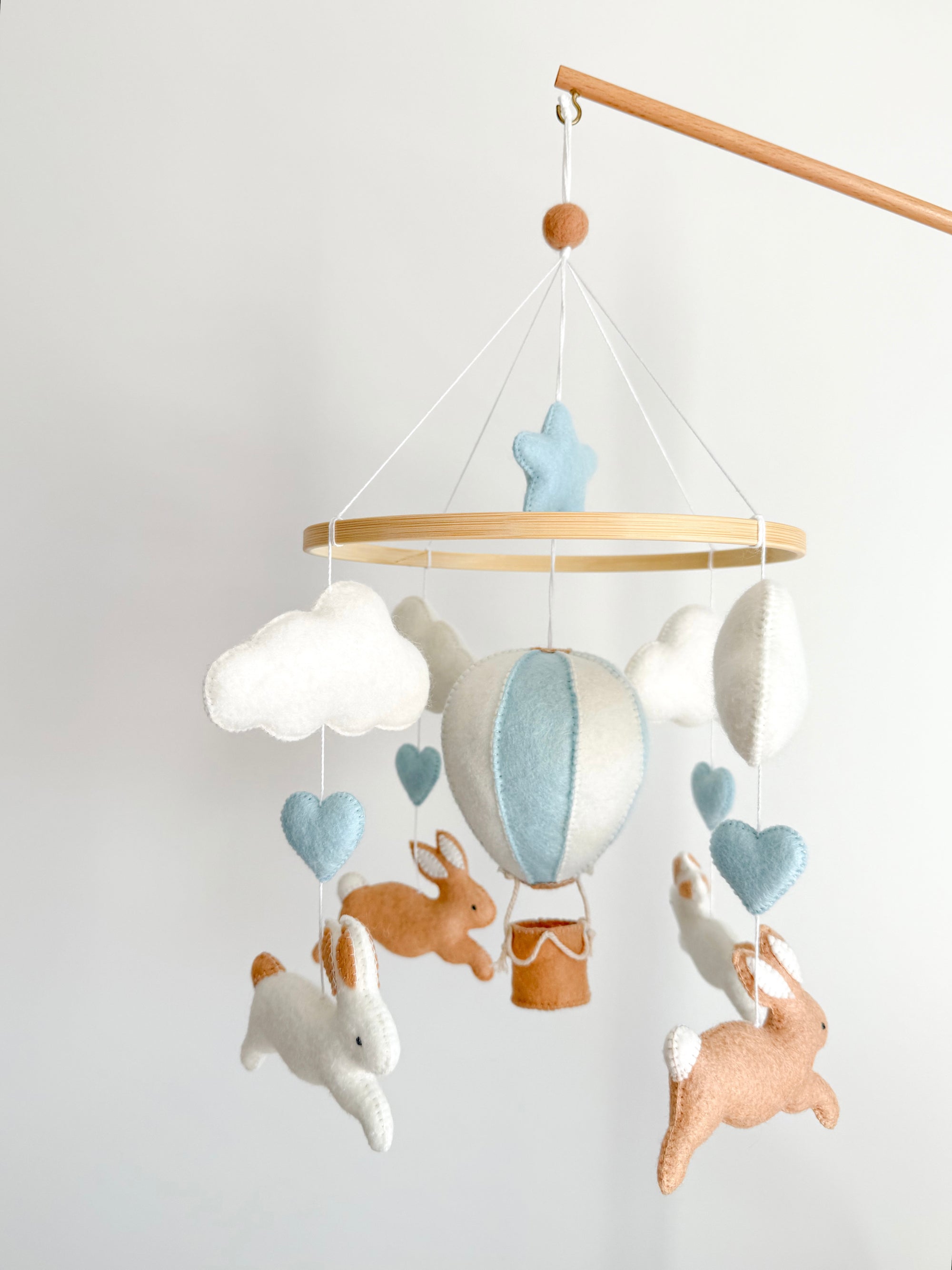 Brown bunny mobile with blue air ballon