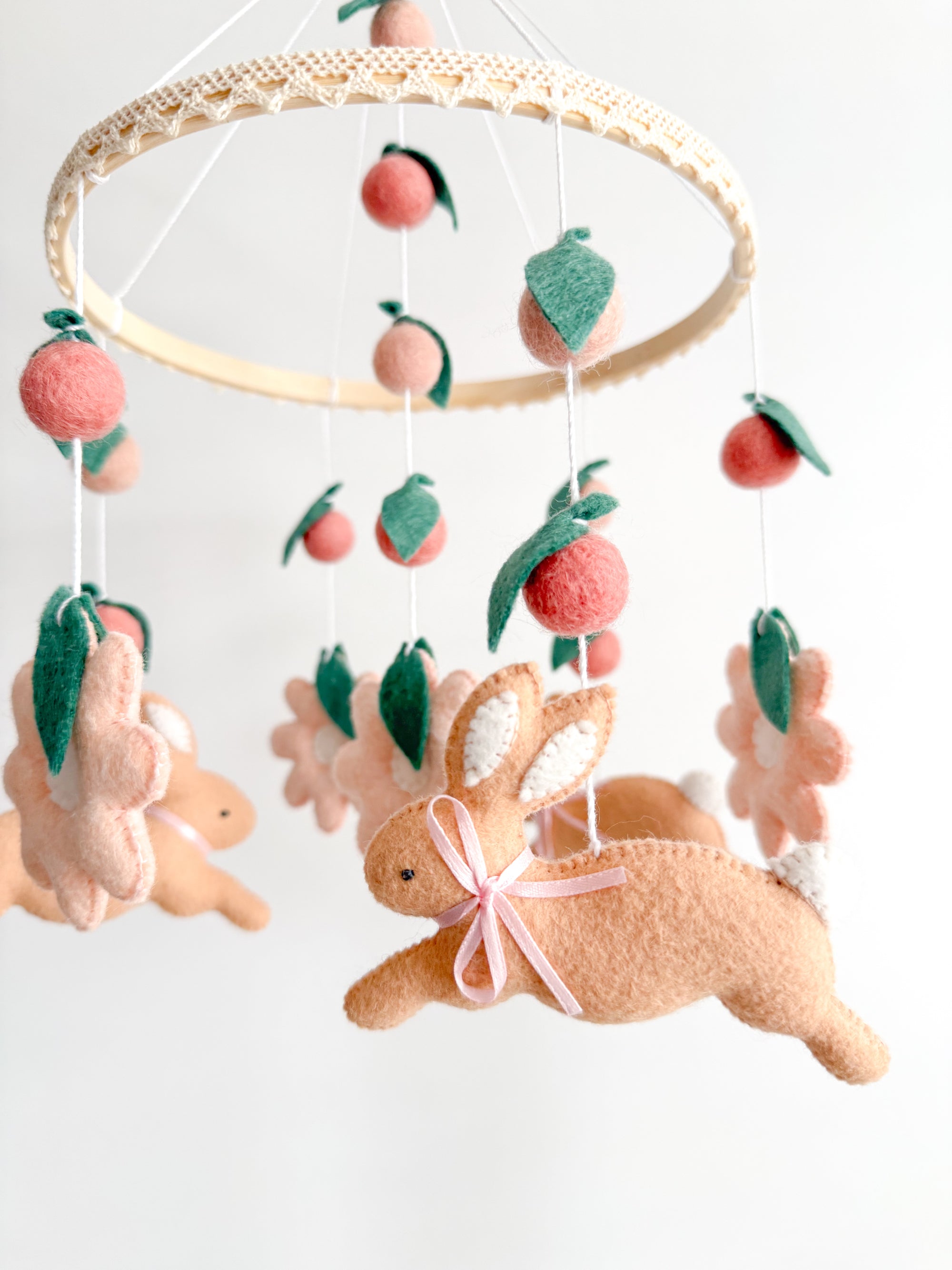 Rabbit mobile with pink flowers