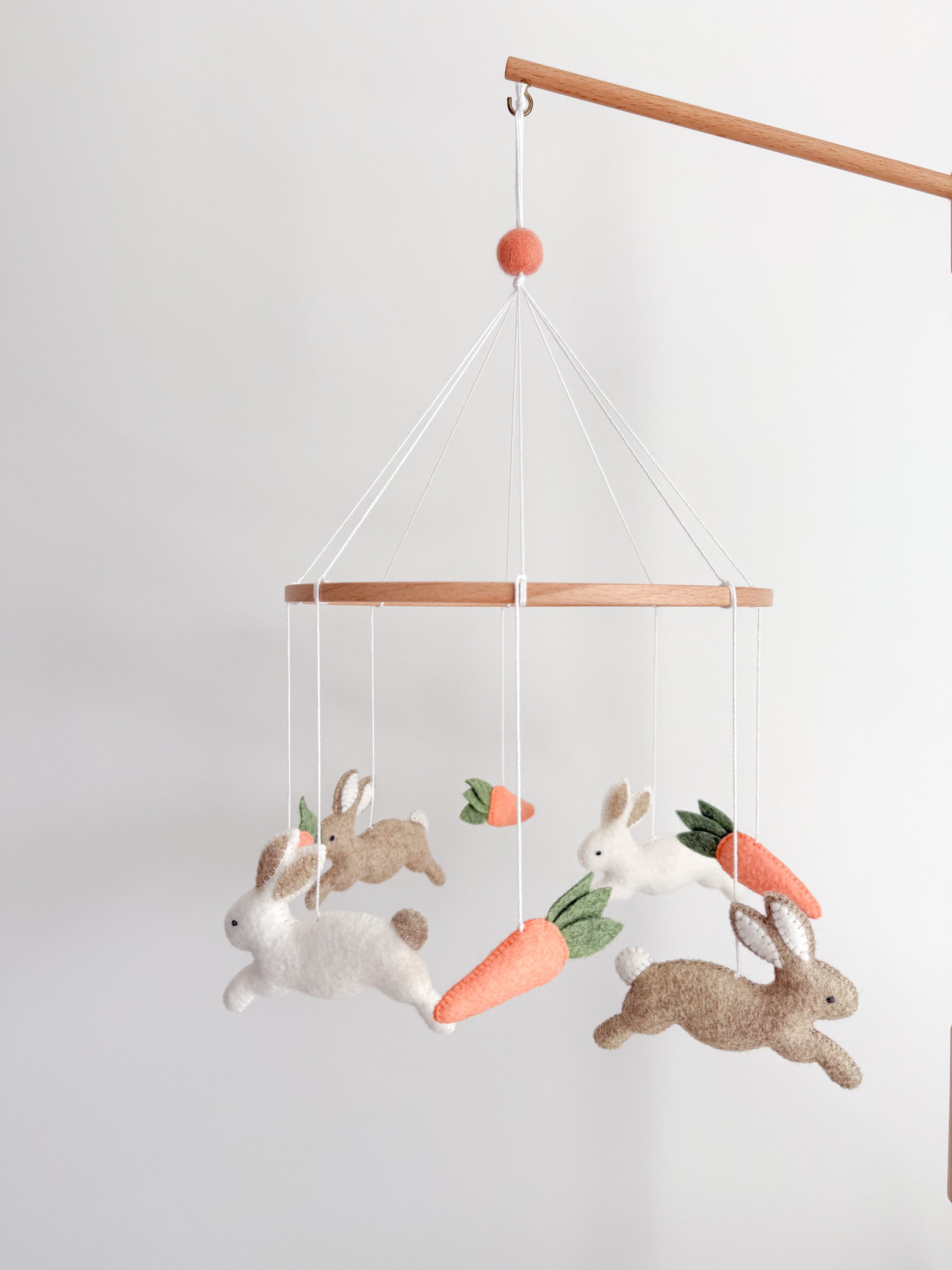 Minimalist bunny mobile with carrots
