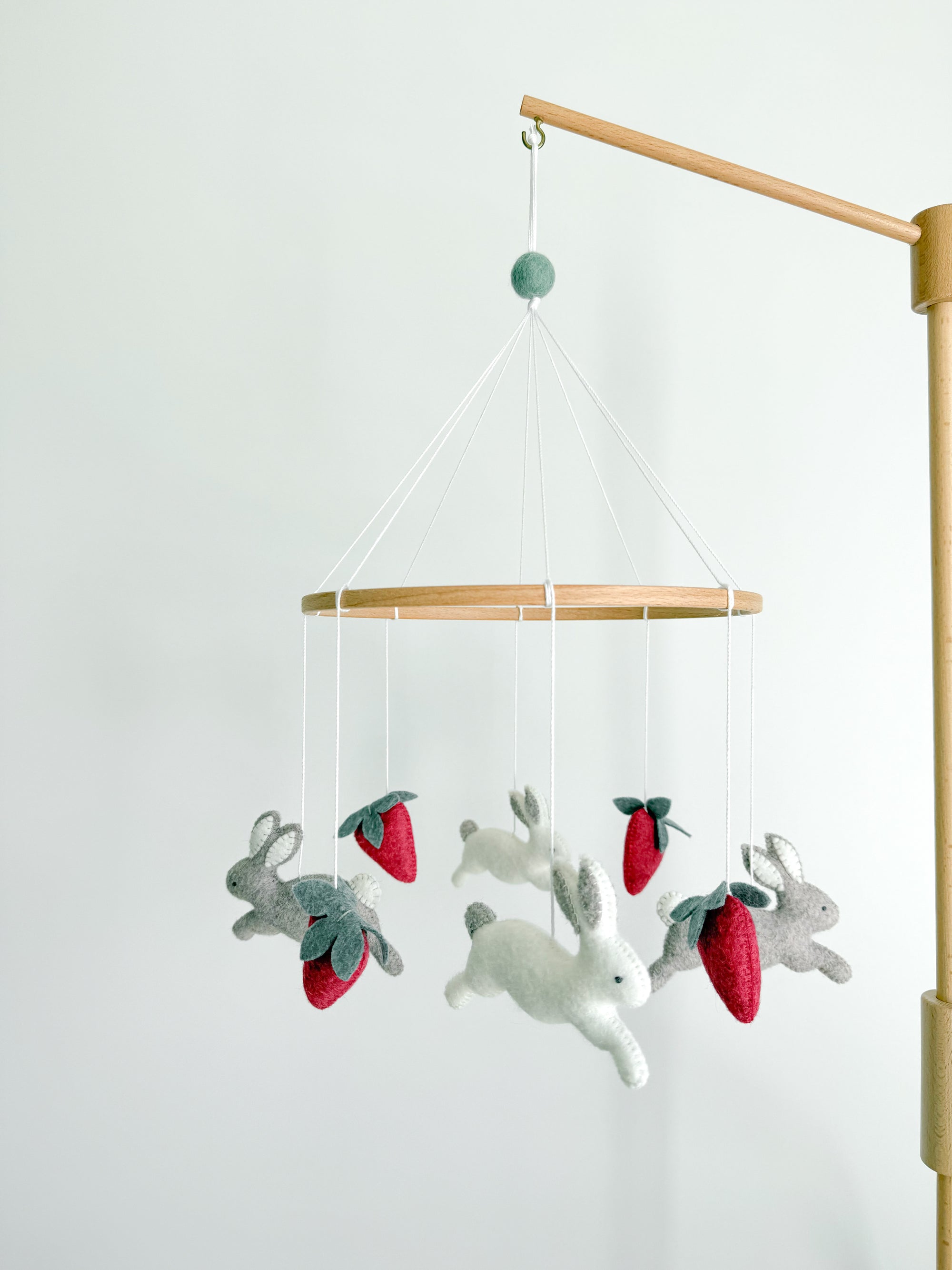 Minimalist bunny mobile with strawberries