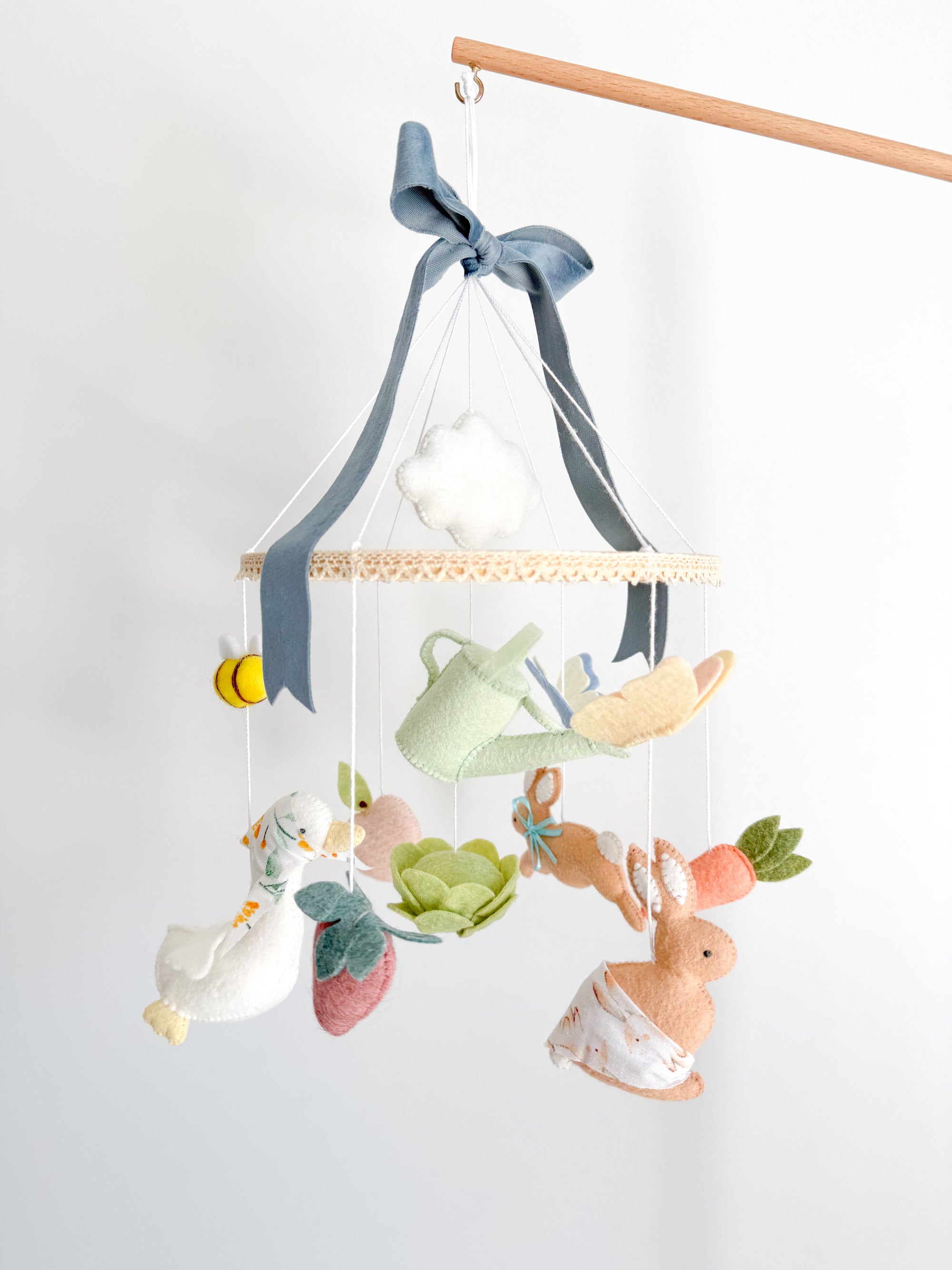 Garden rabbit mobile with blue bow