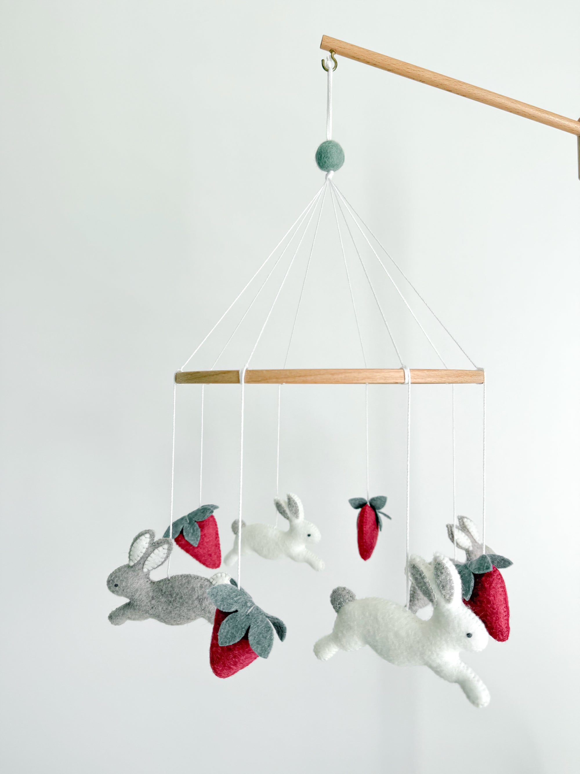 Minimalist bunny mobile with strawberries