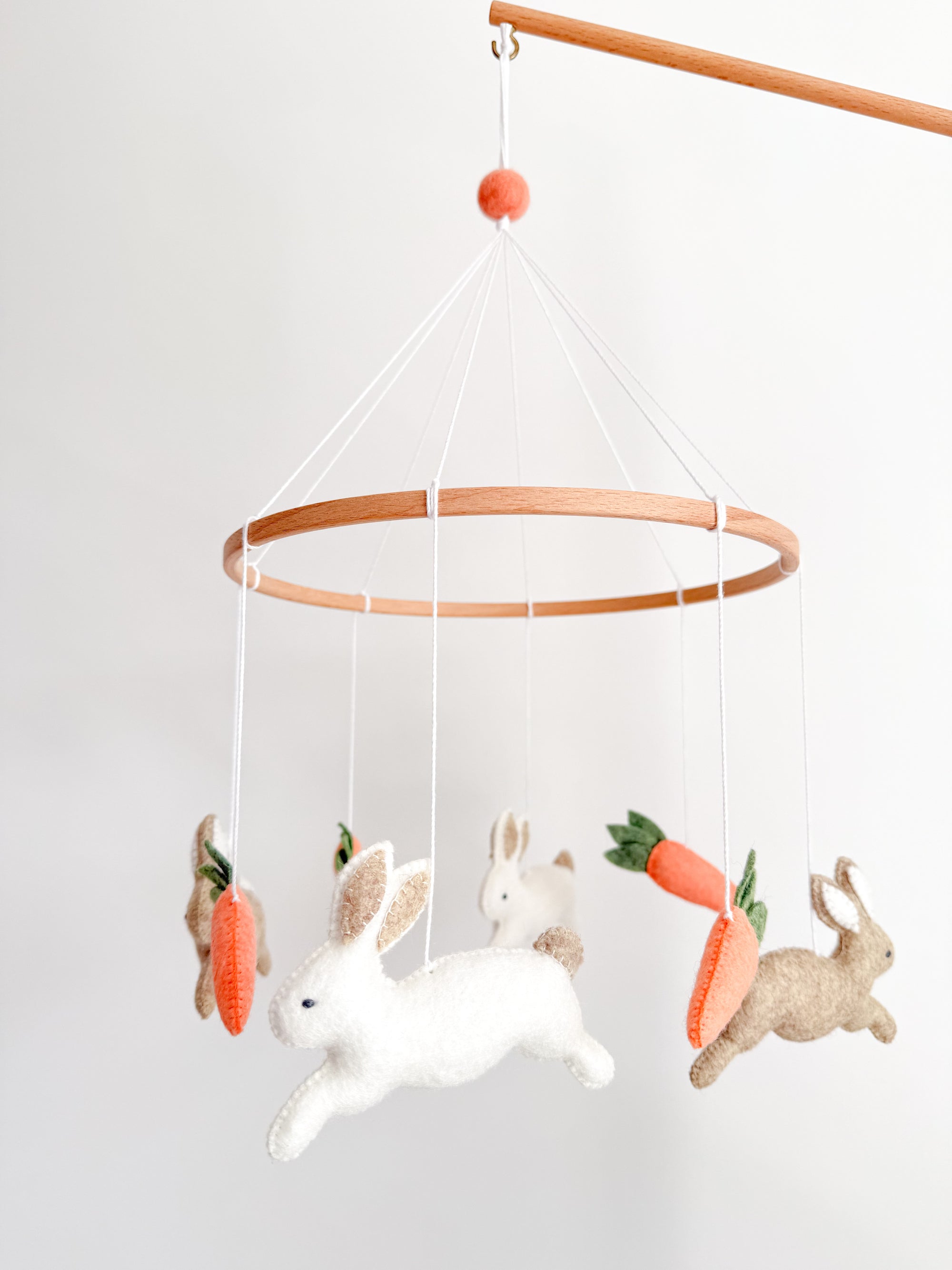 Minimalist bunny mobile with carrots