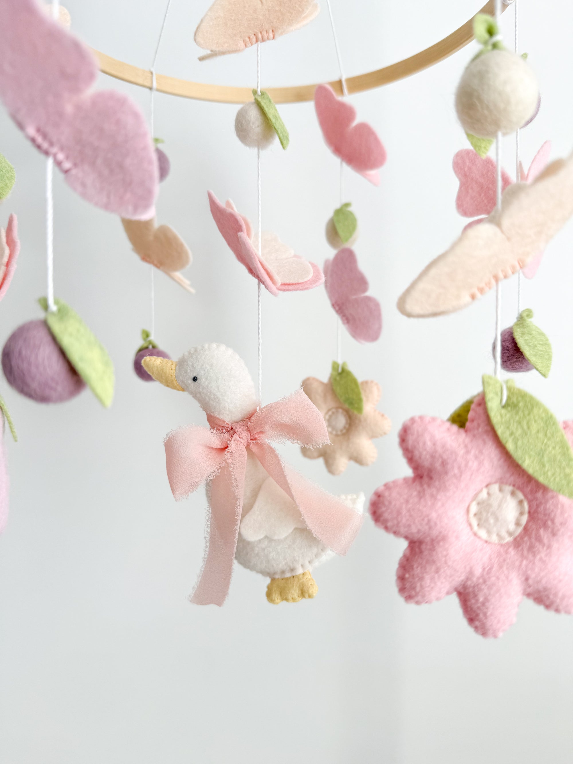 Mobile with a goose and butterflies