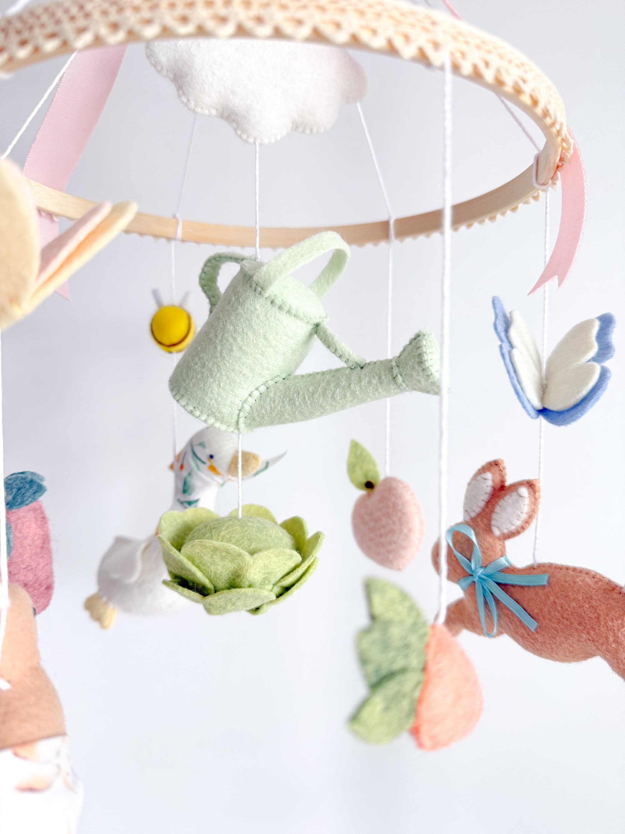 Garden rabbit mobile with pink bow