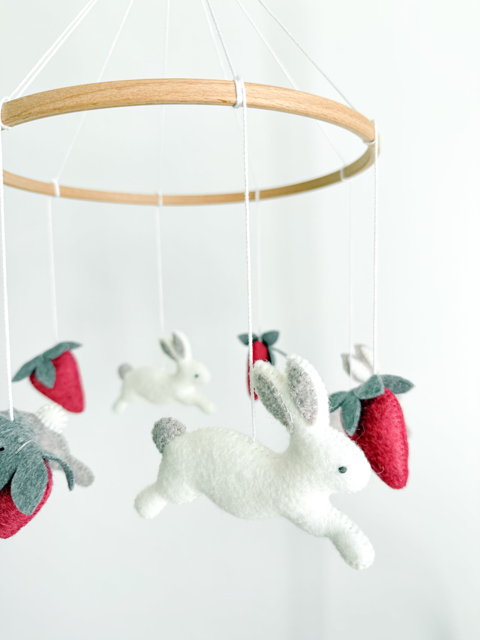 Minimalist bunny mobile with strawberries