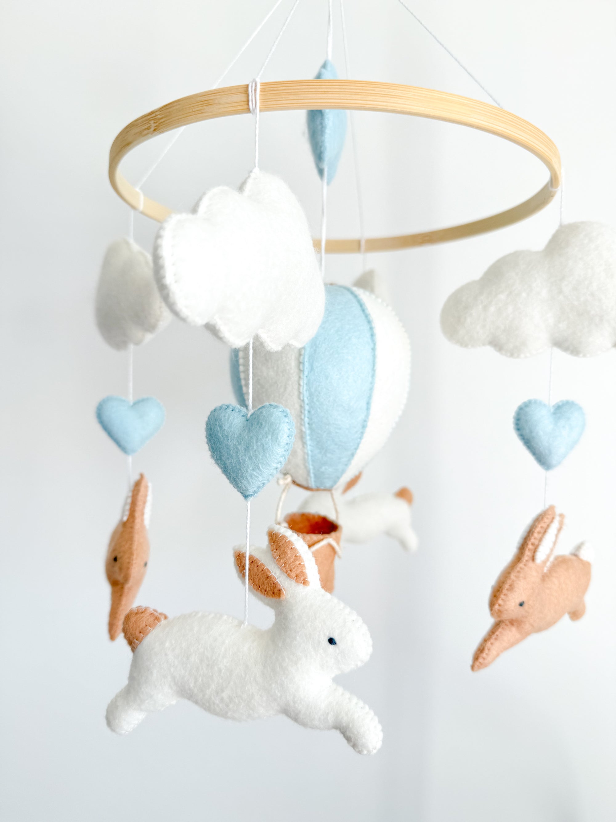 Brown bunny mobile with blue air ballon