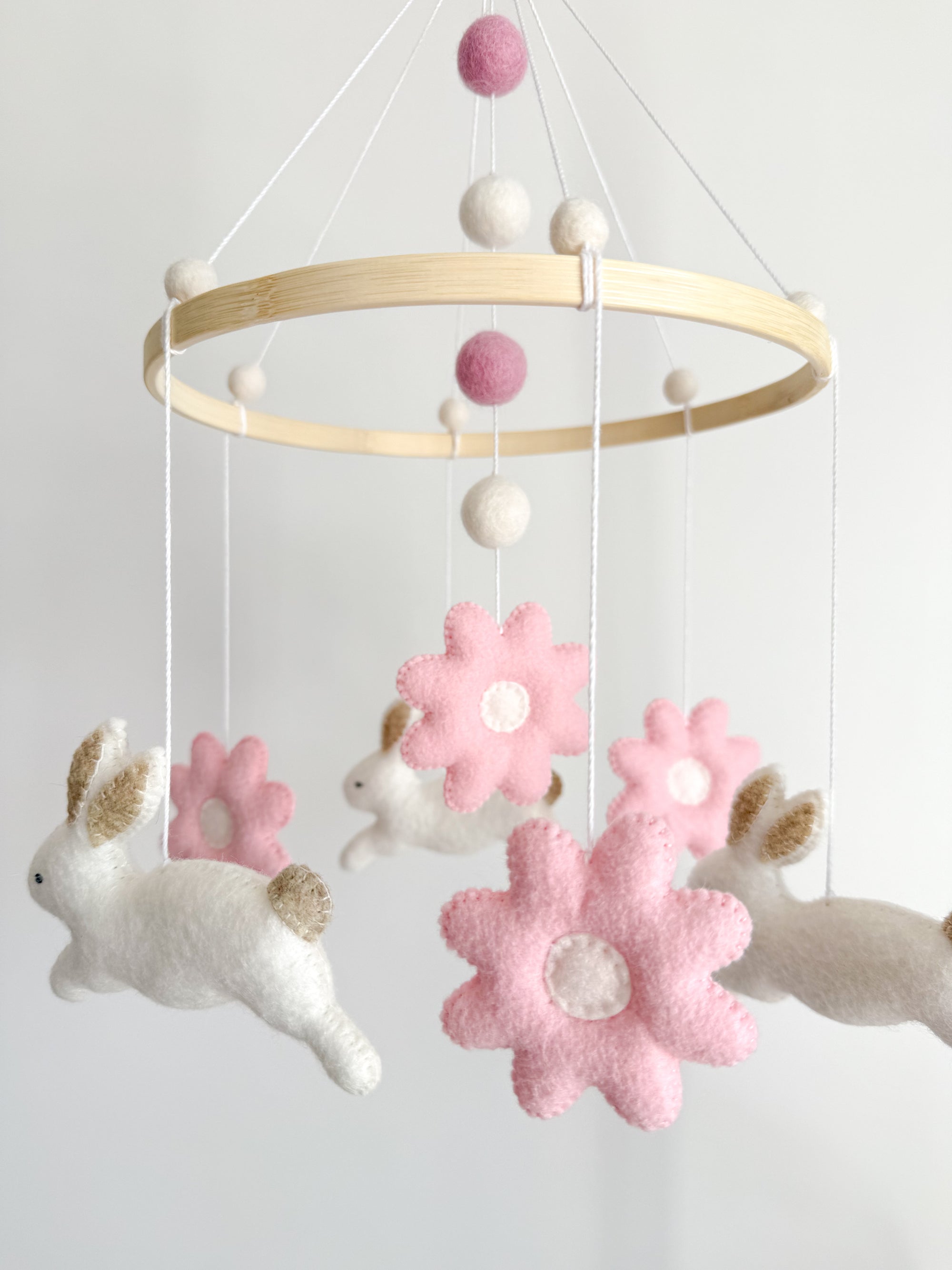 Bunny mobile with pink flowers