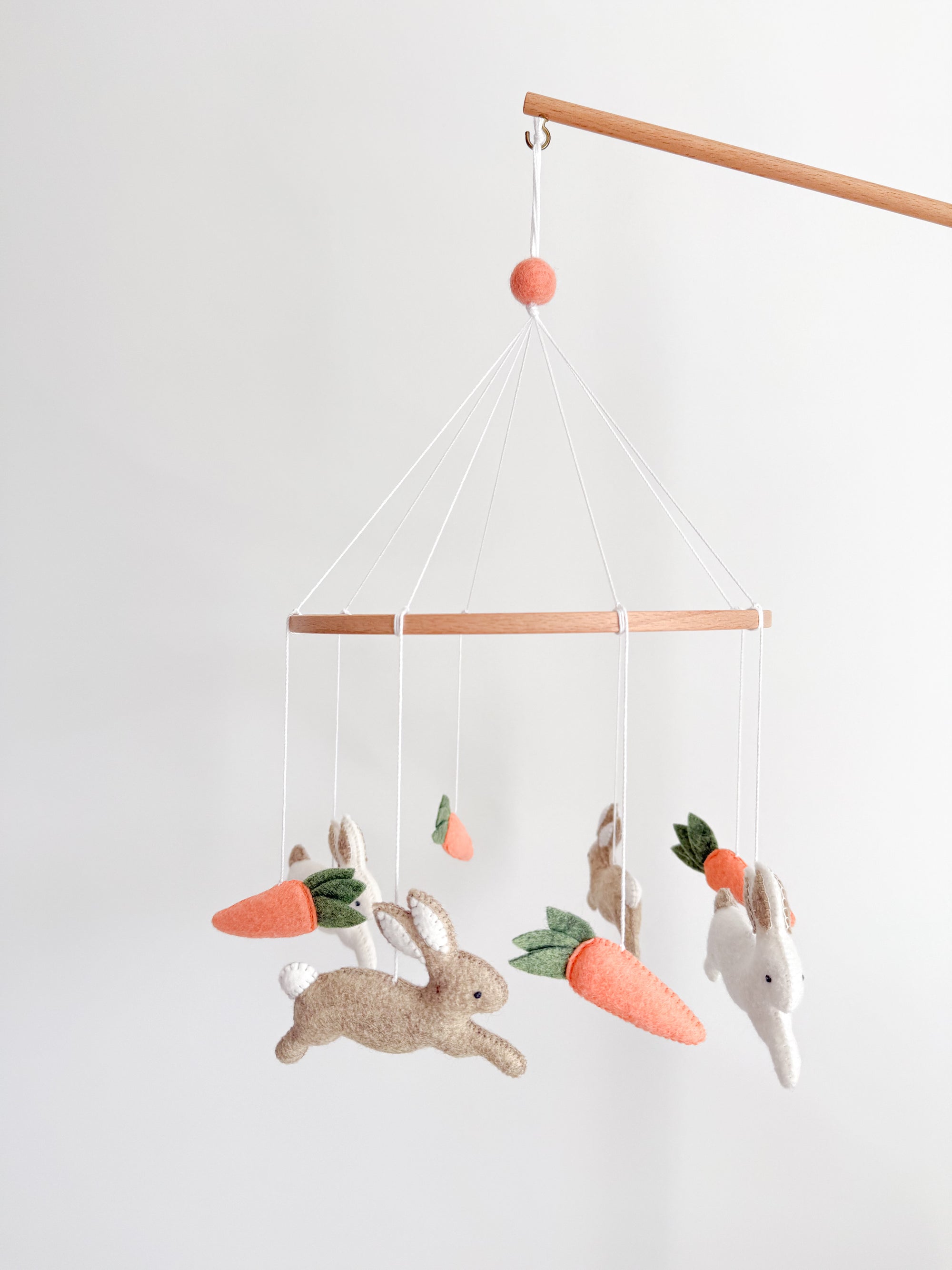 Minimalist bunny mobile with carrots