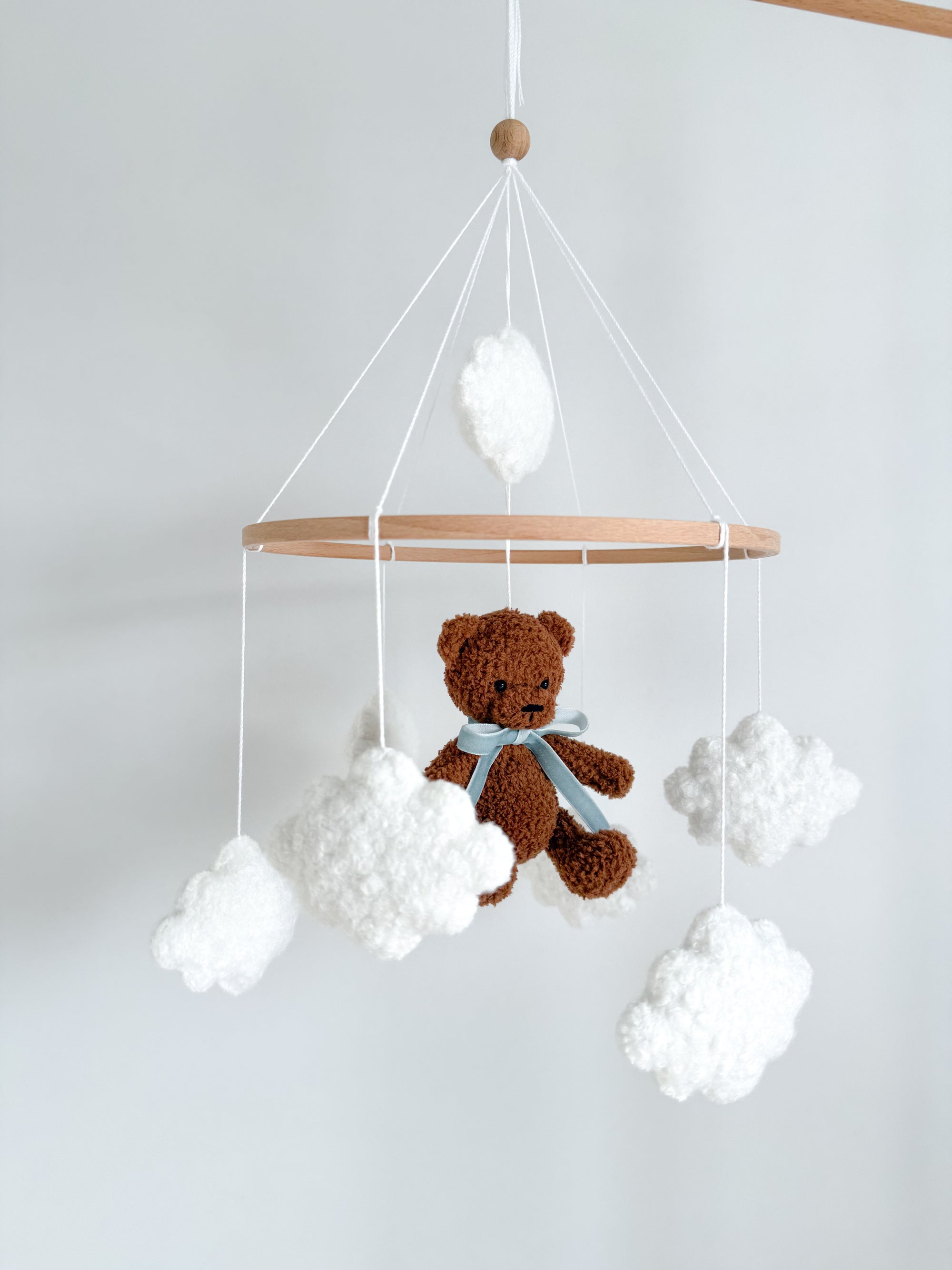 Boucle mobile with dark brown teddy bear