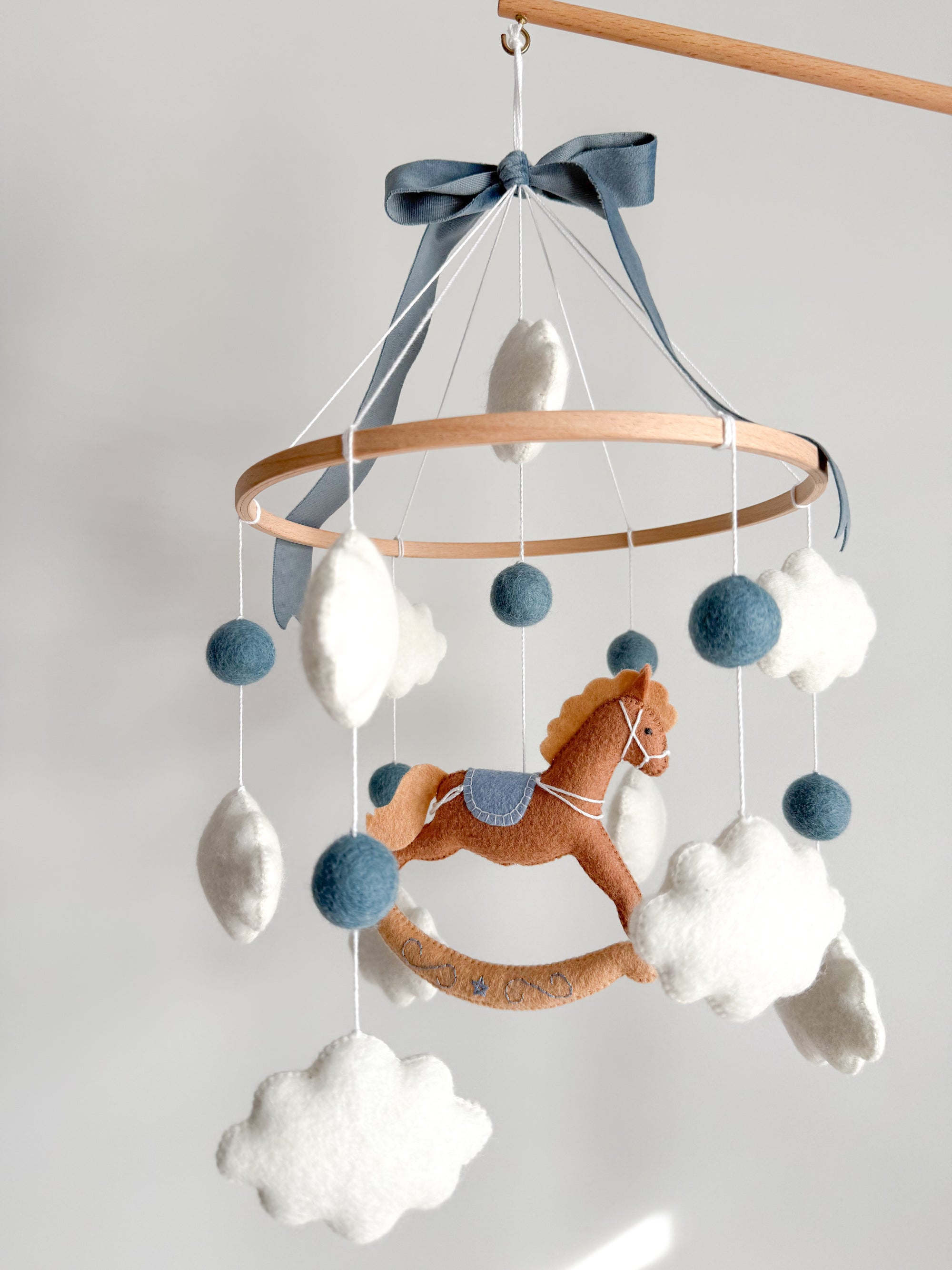 Mobile with a brown rocking horse