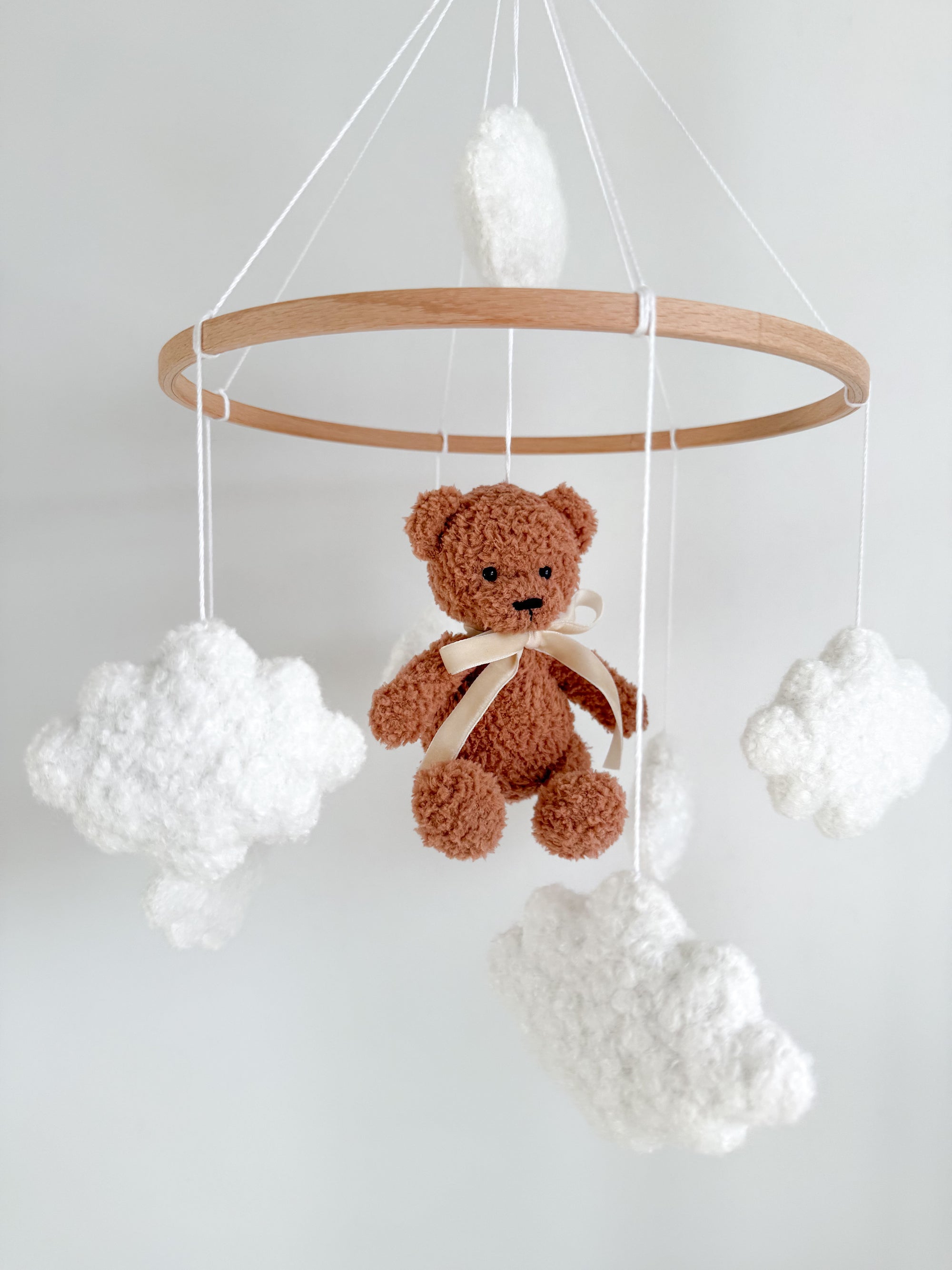 Boucle mobile with brown teddy bear