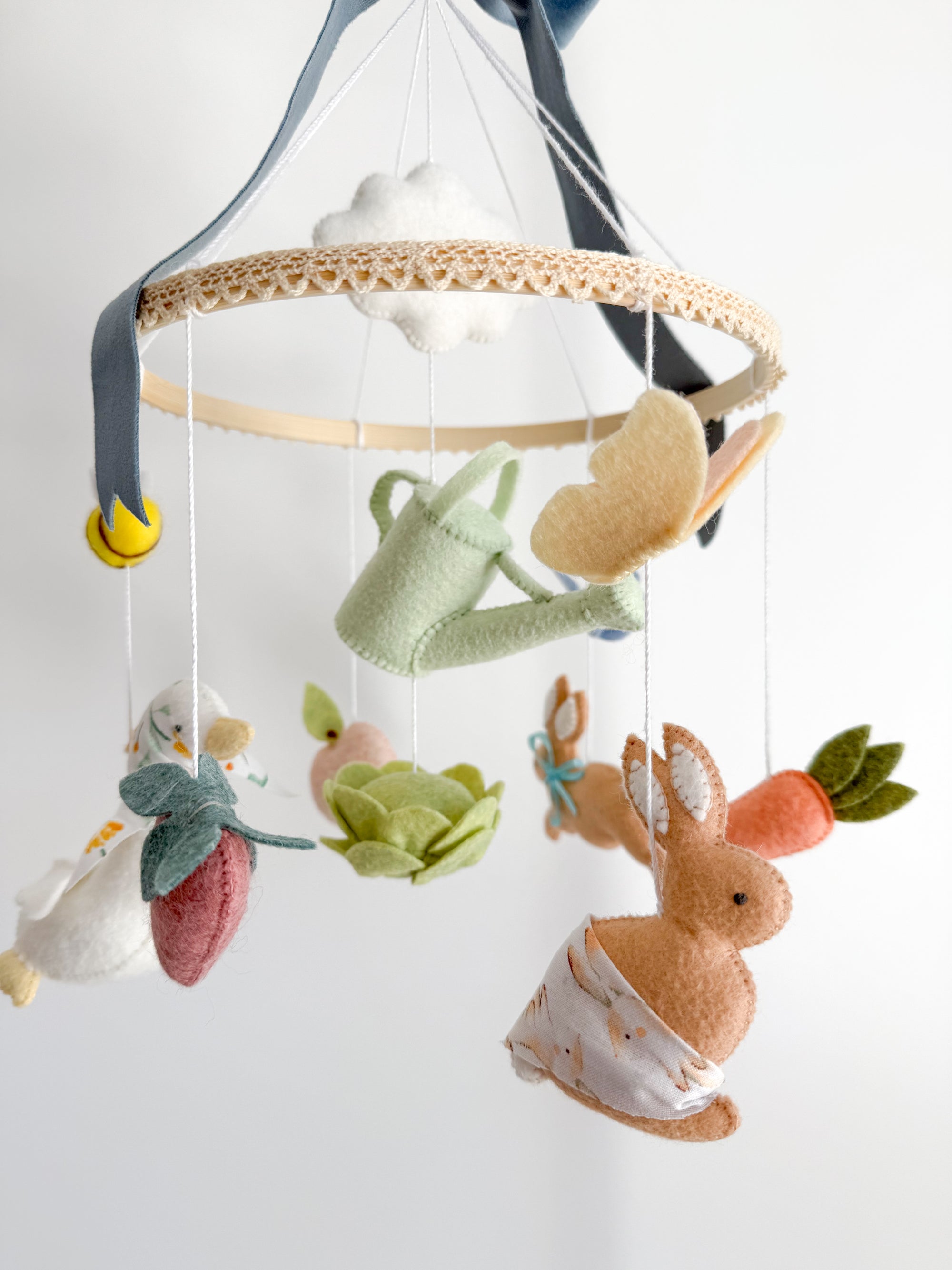 Garden rabbit mobile with blue bow