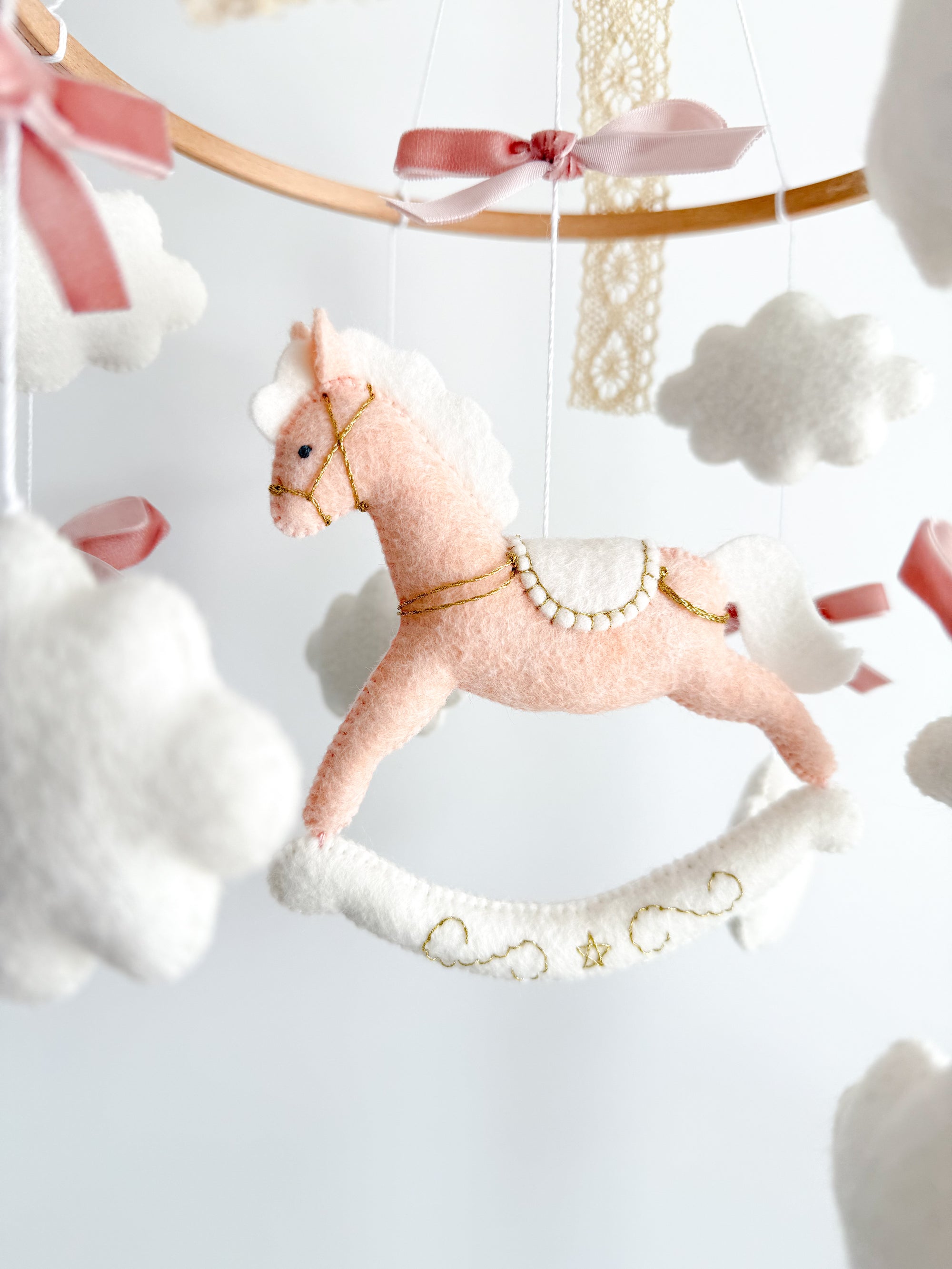 Mobile with a pink rocking horse
