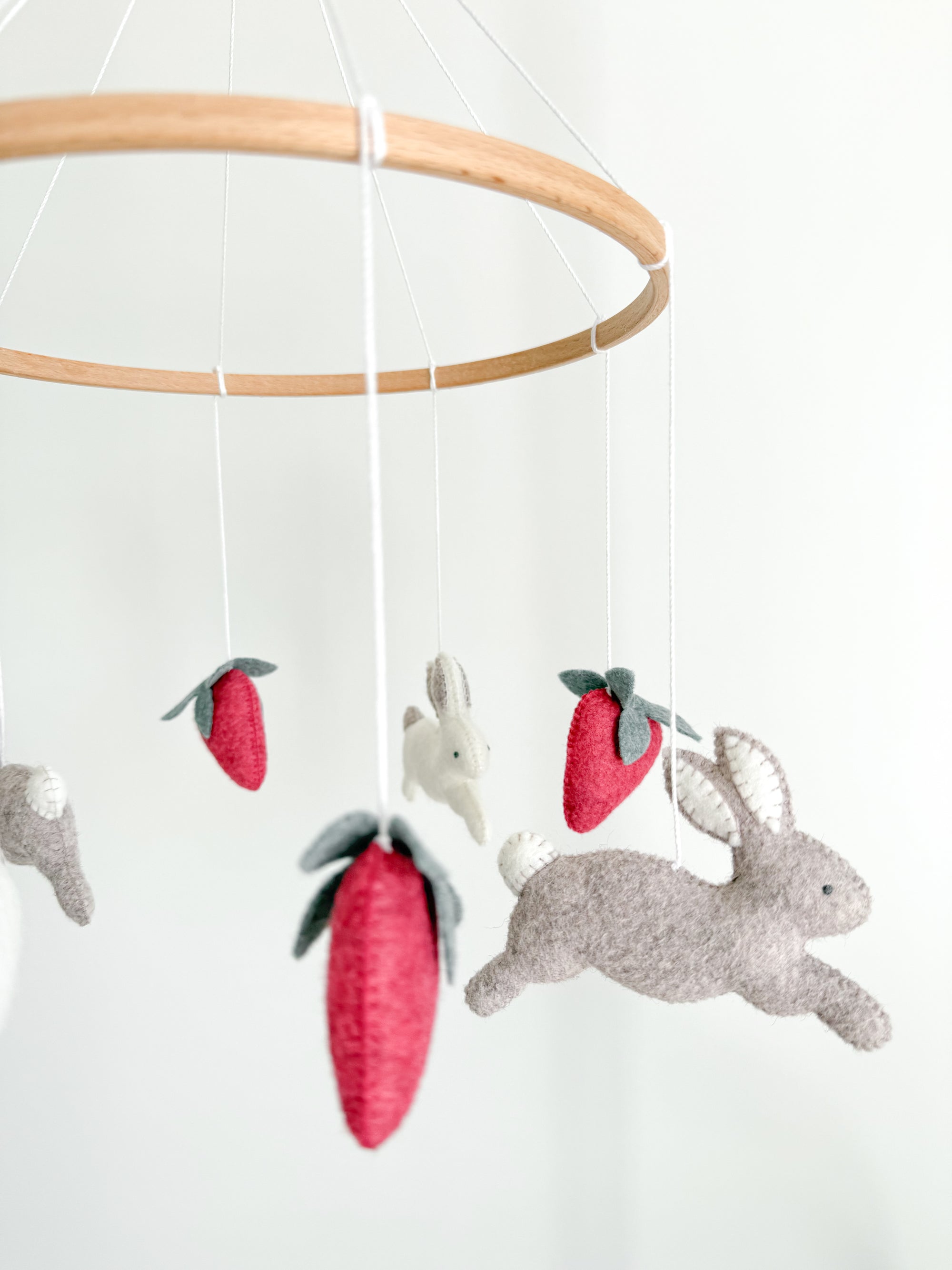 Minimalist bunny mobile with strawberries