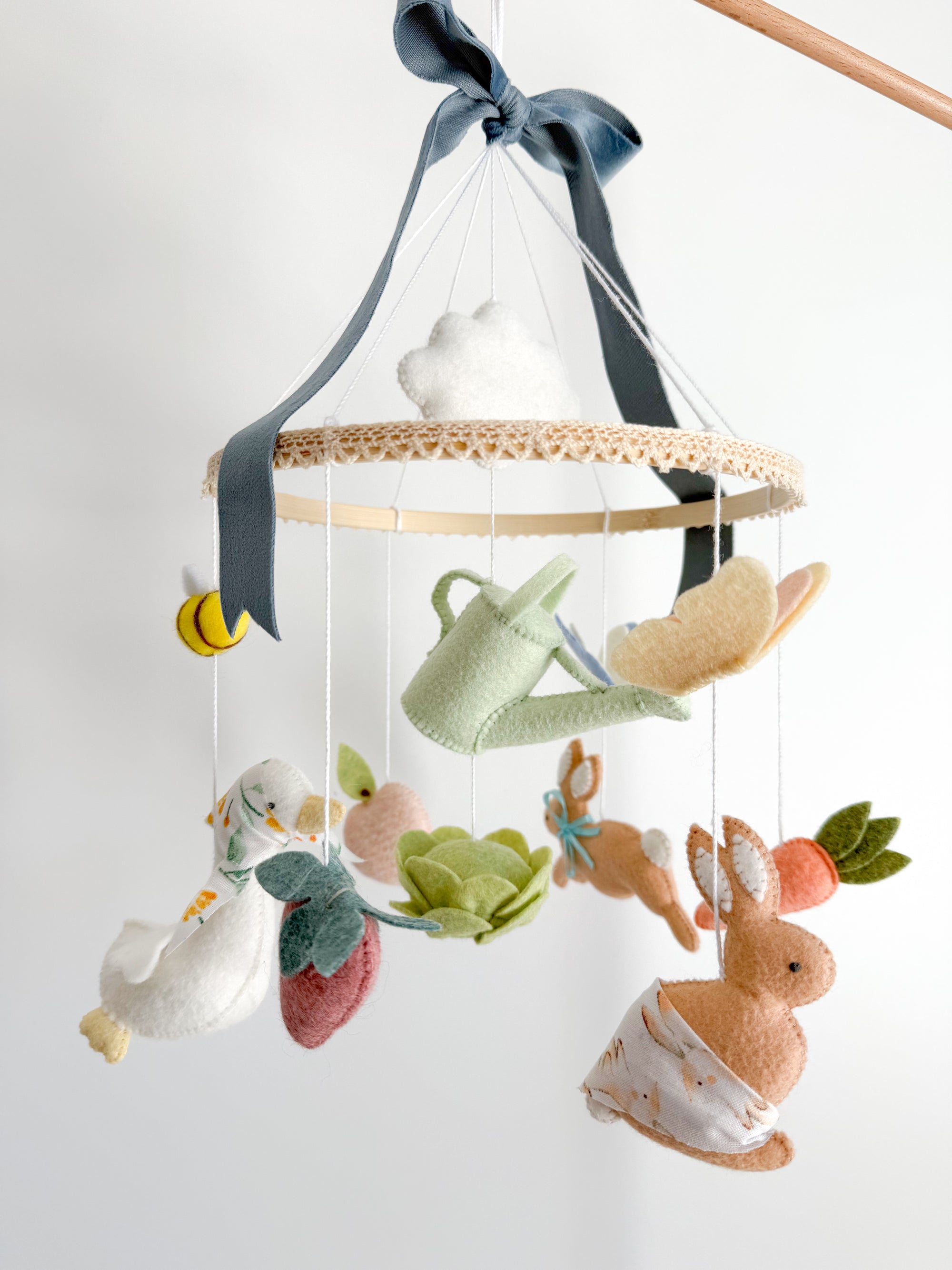 Garden rabbit mobile with blue bow