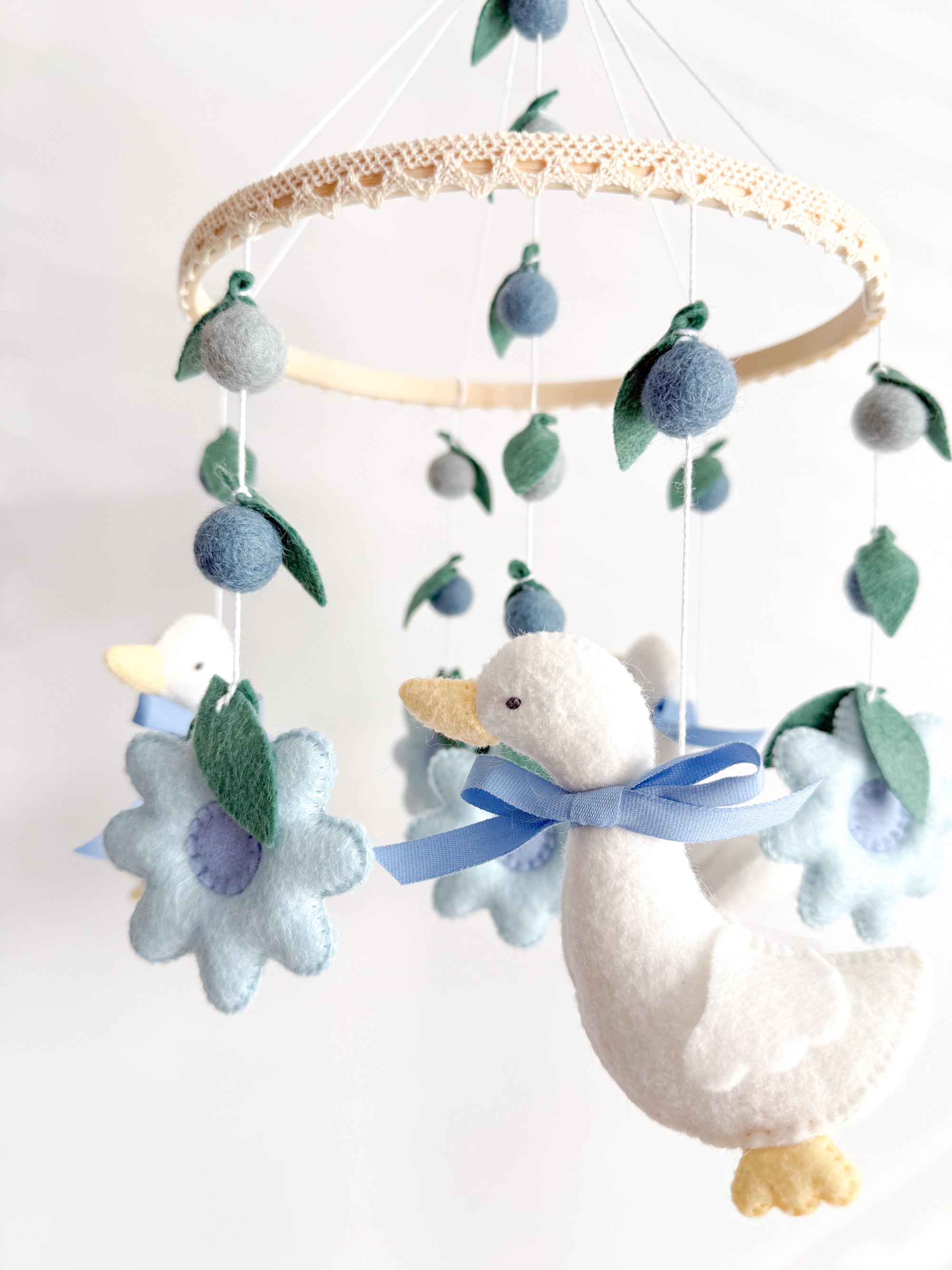 Goose mobile with blue flowers