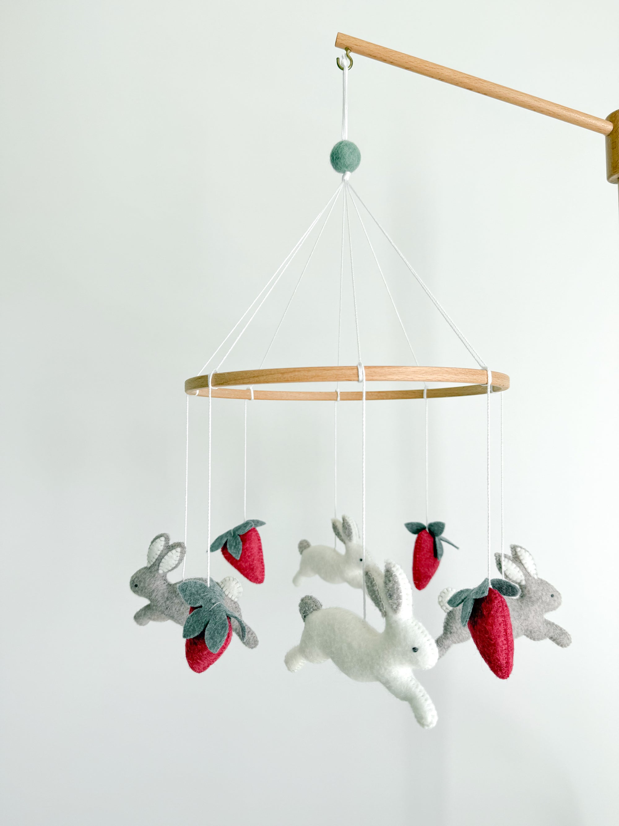 Minimalist bunny mobile with strawberries