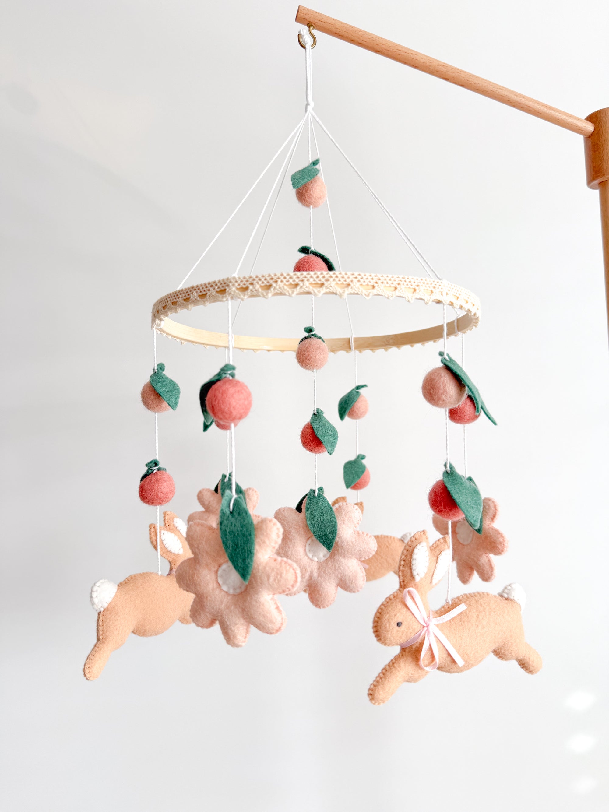 Rabbit mobile with pink flowers
