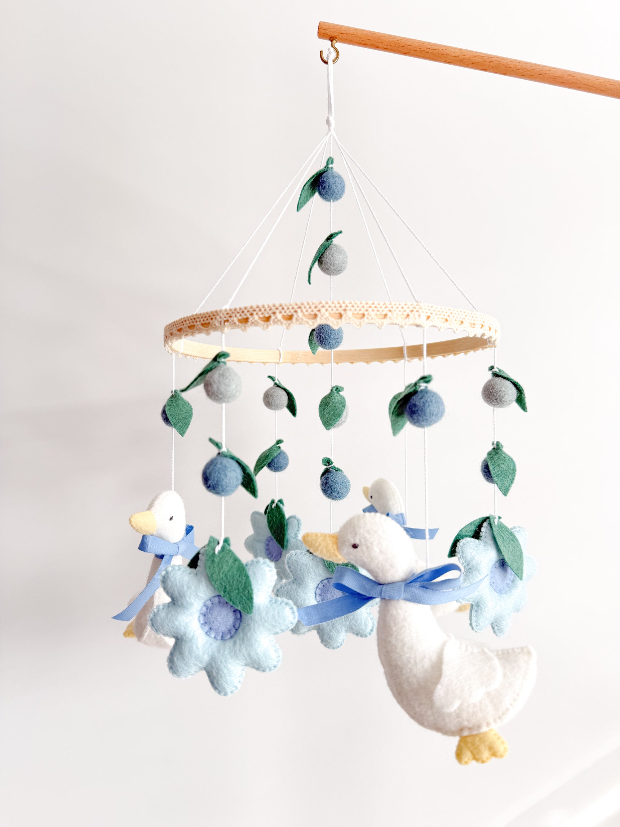 Goose mobile with blue flowers