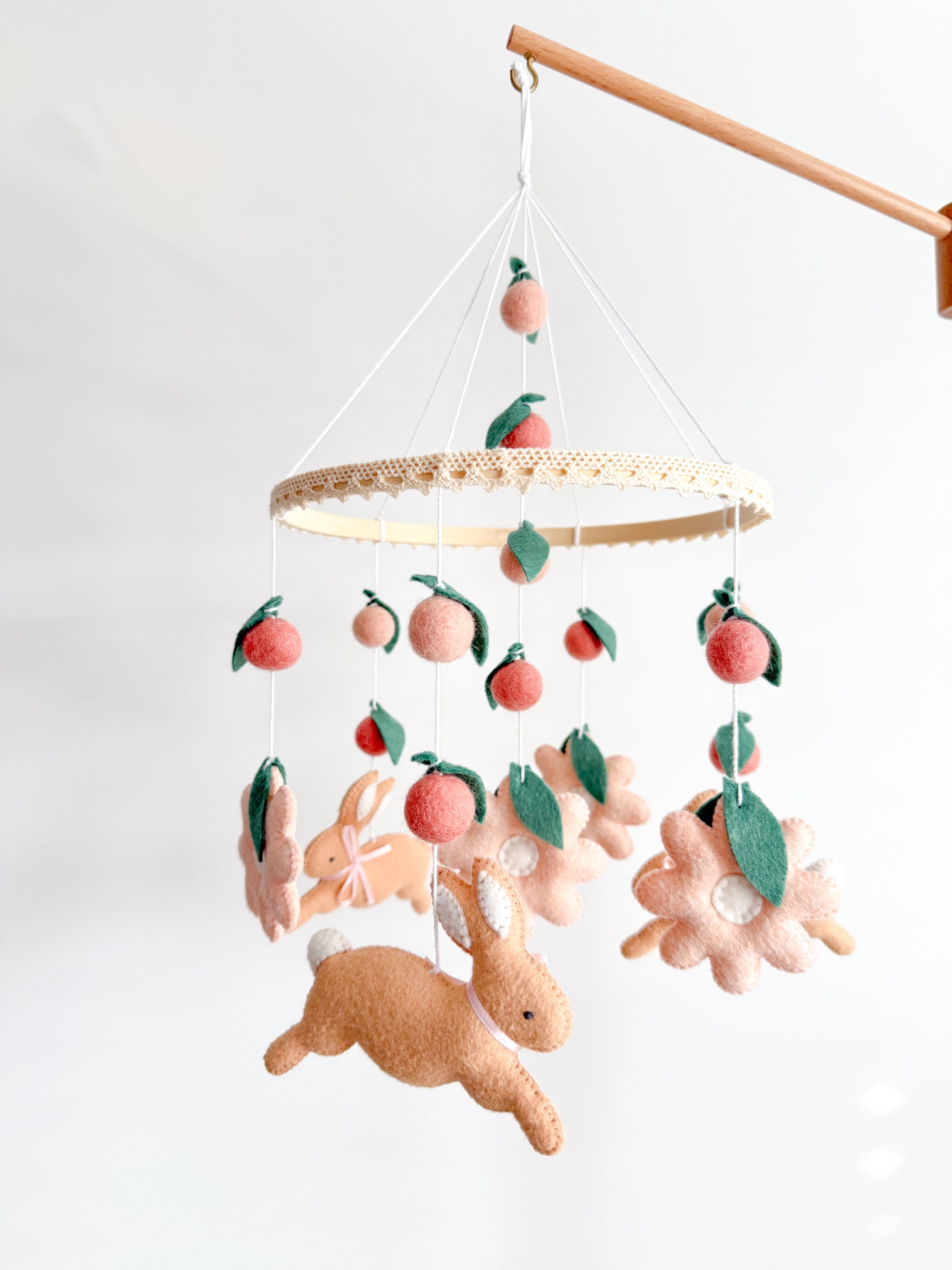Rabbit mobile with pink flowers