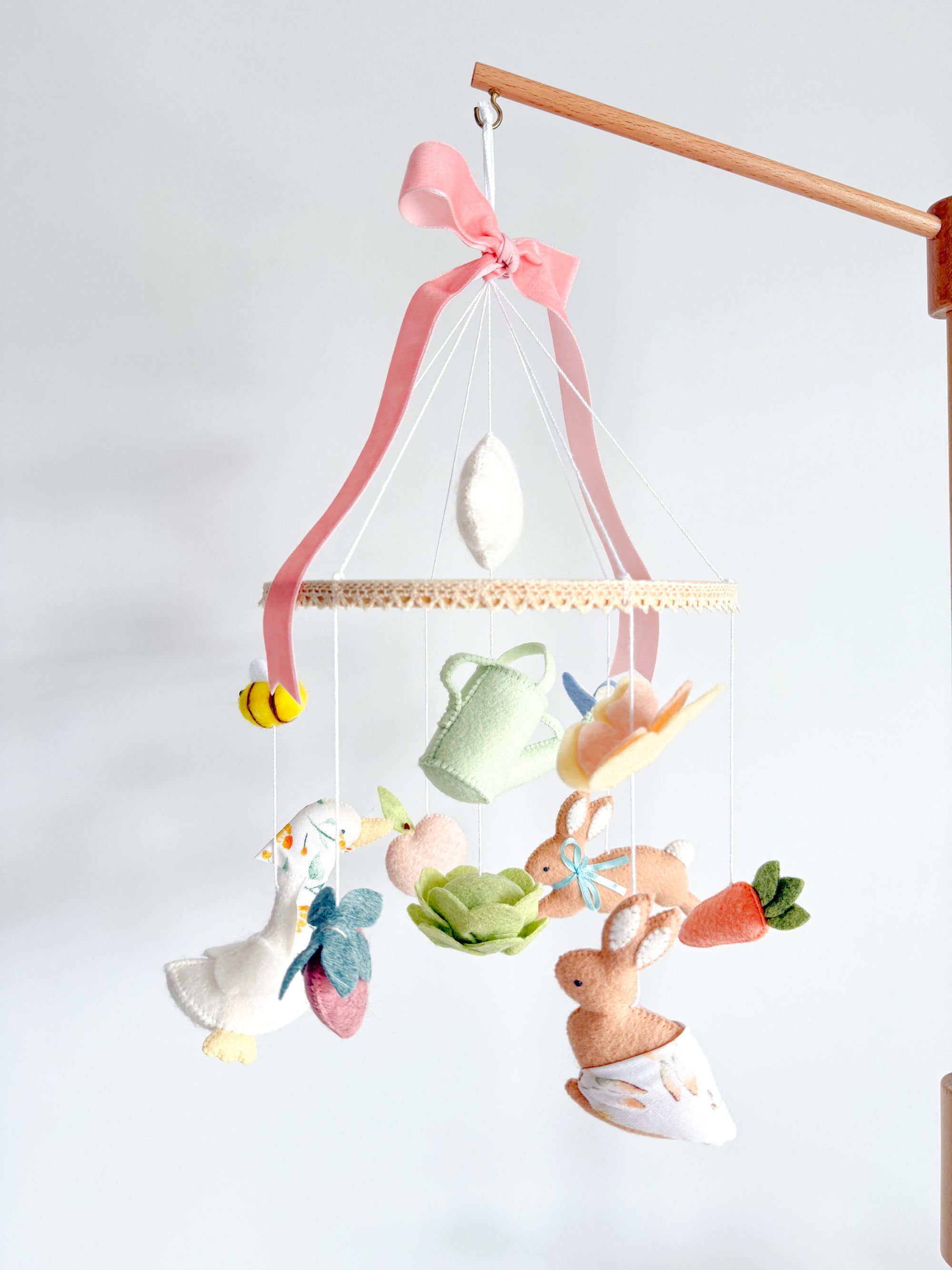 Garden rabbit mobile with pink bow