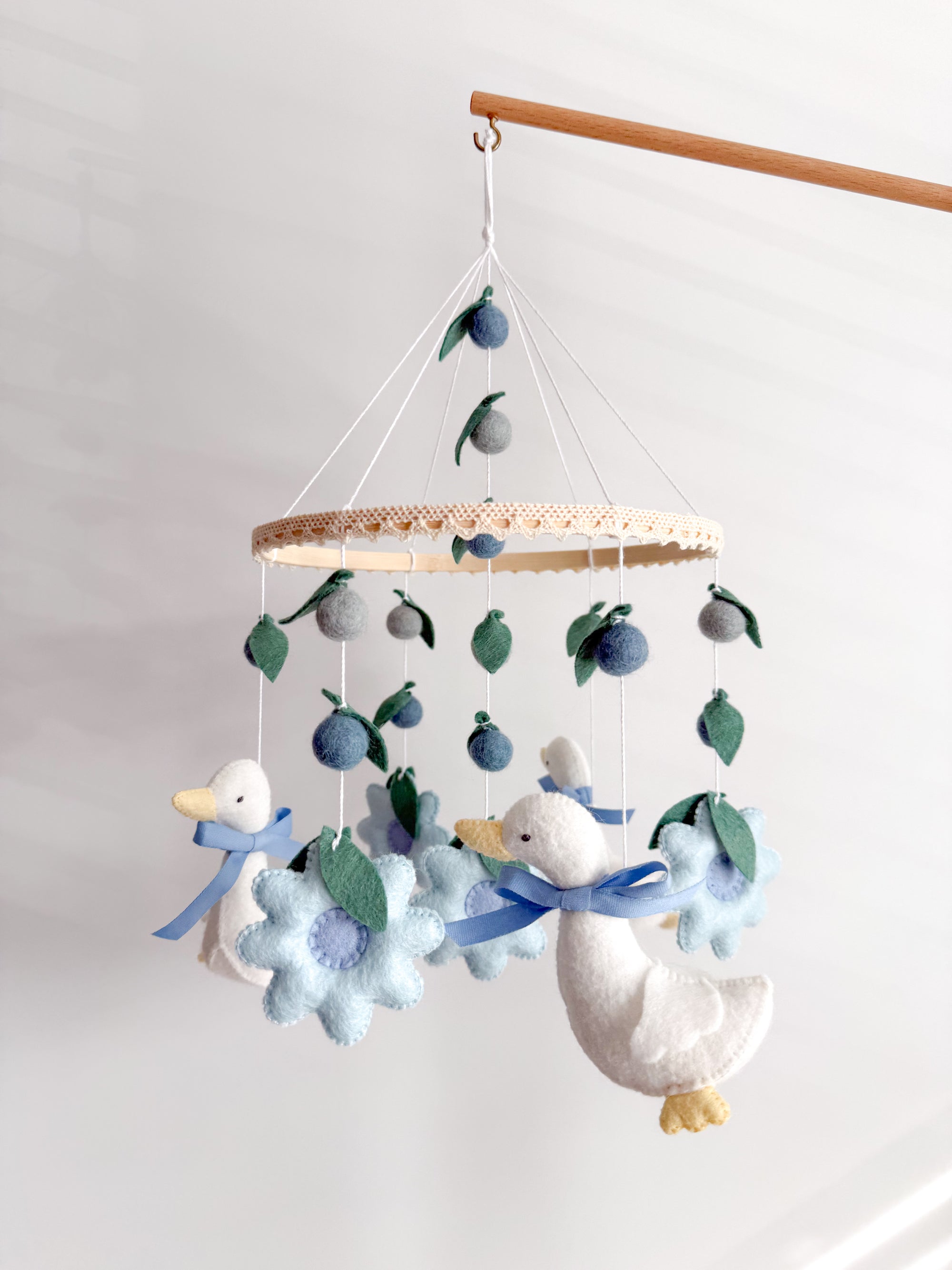 Goose mobile with blue flowers