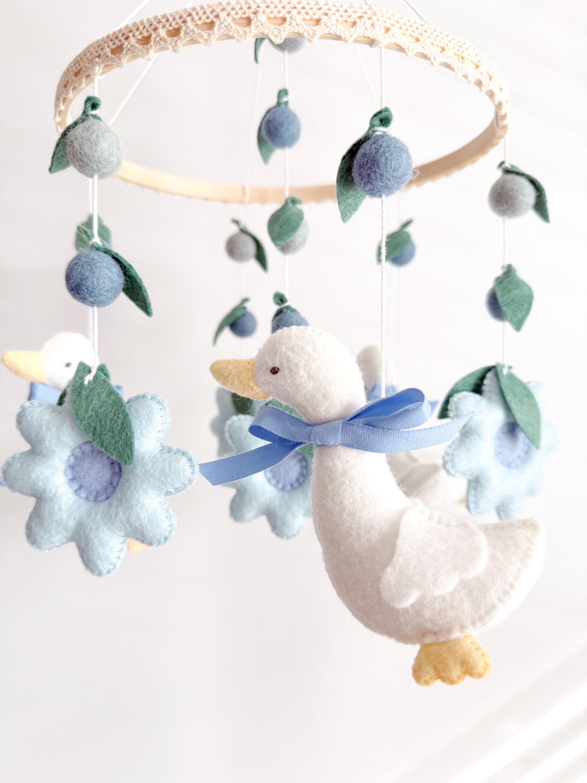 Goose mobile with blue flowers