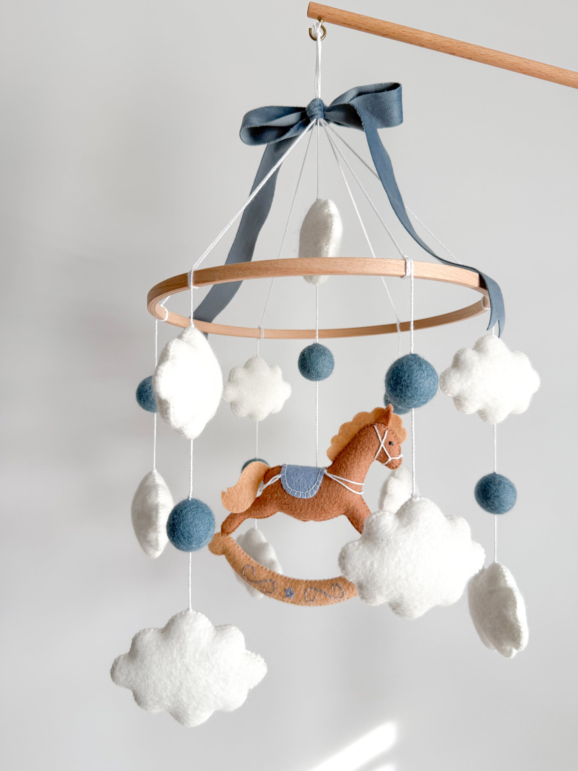 Mobile with a brown rocking horse
