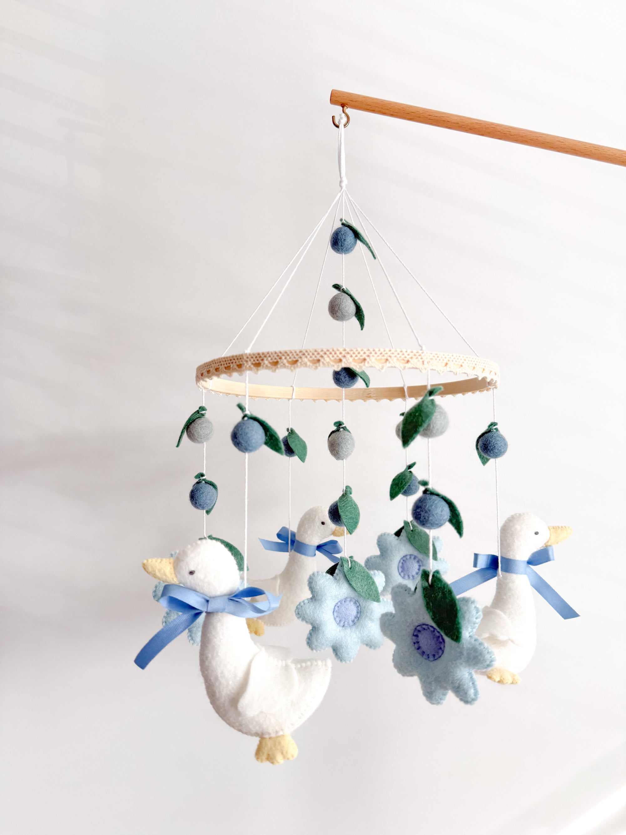 Goose mobile with blue flowers