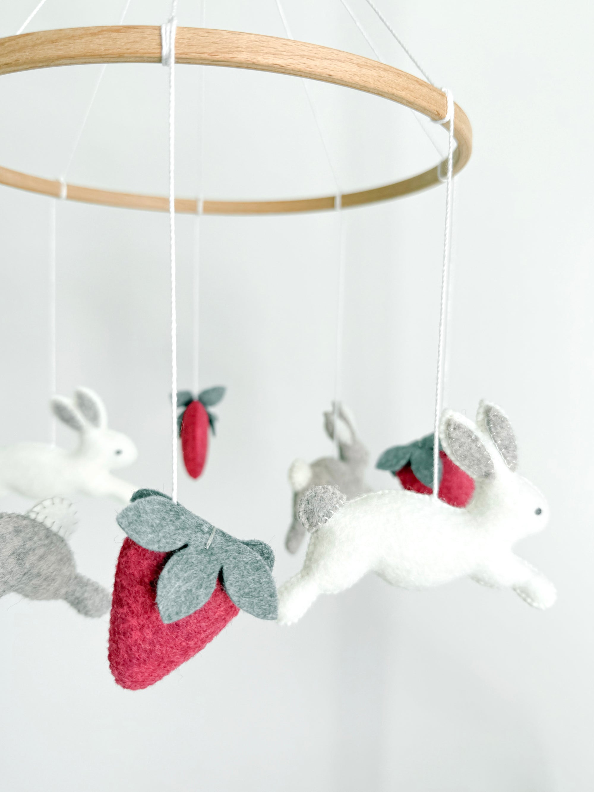 Minimalist bunny mobile with strawberries