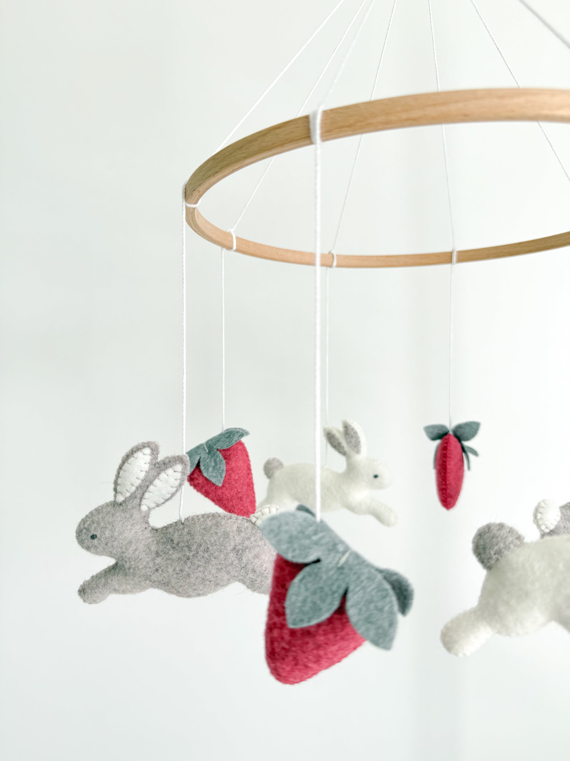 Minimalist bunny mobile with strawberries