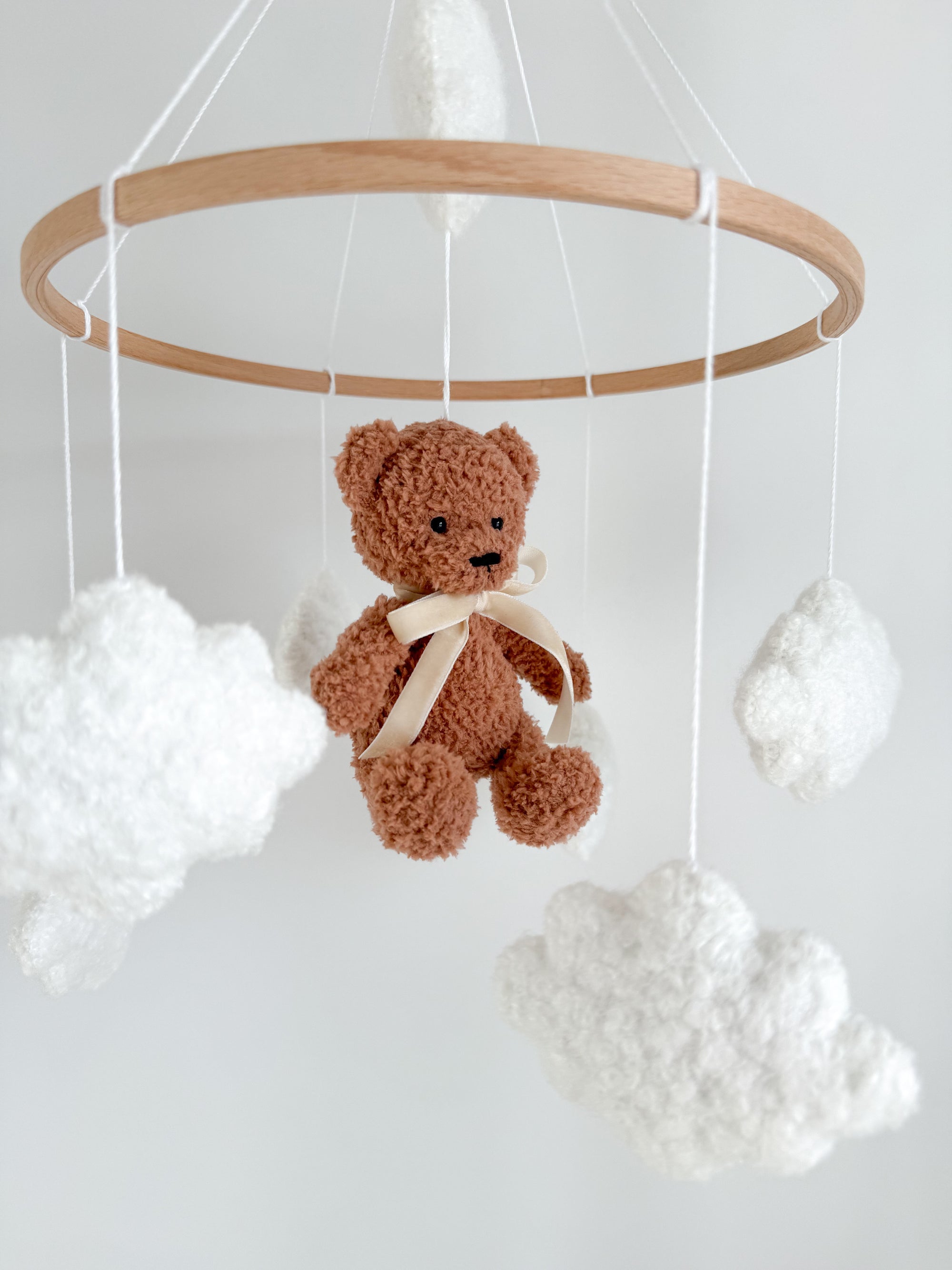 Boucle mobile with brown teddy bear