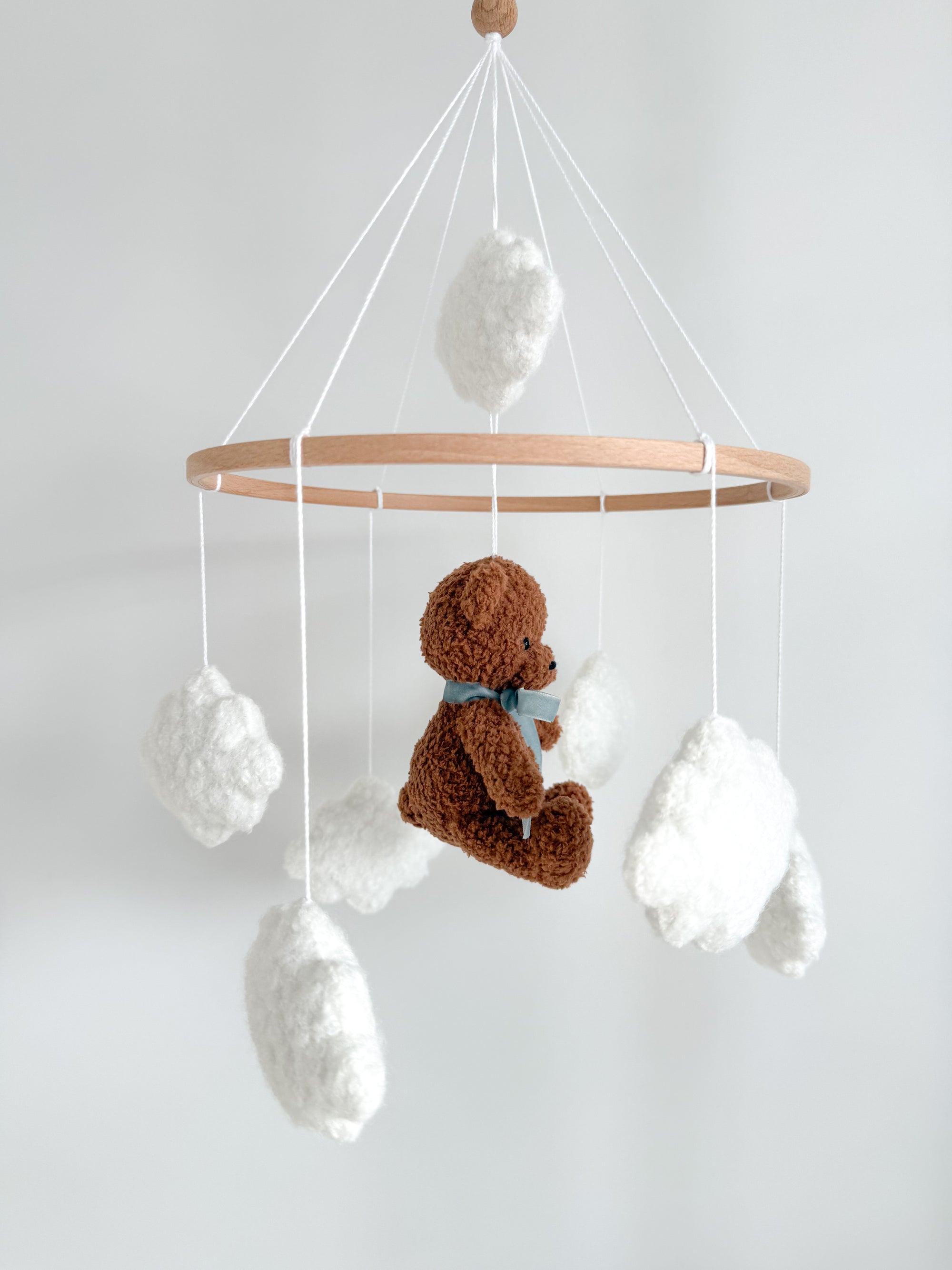 Boucle mobile with dark brown teddy bear