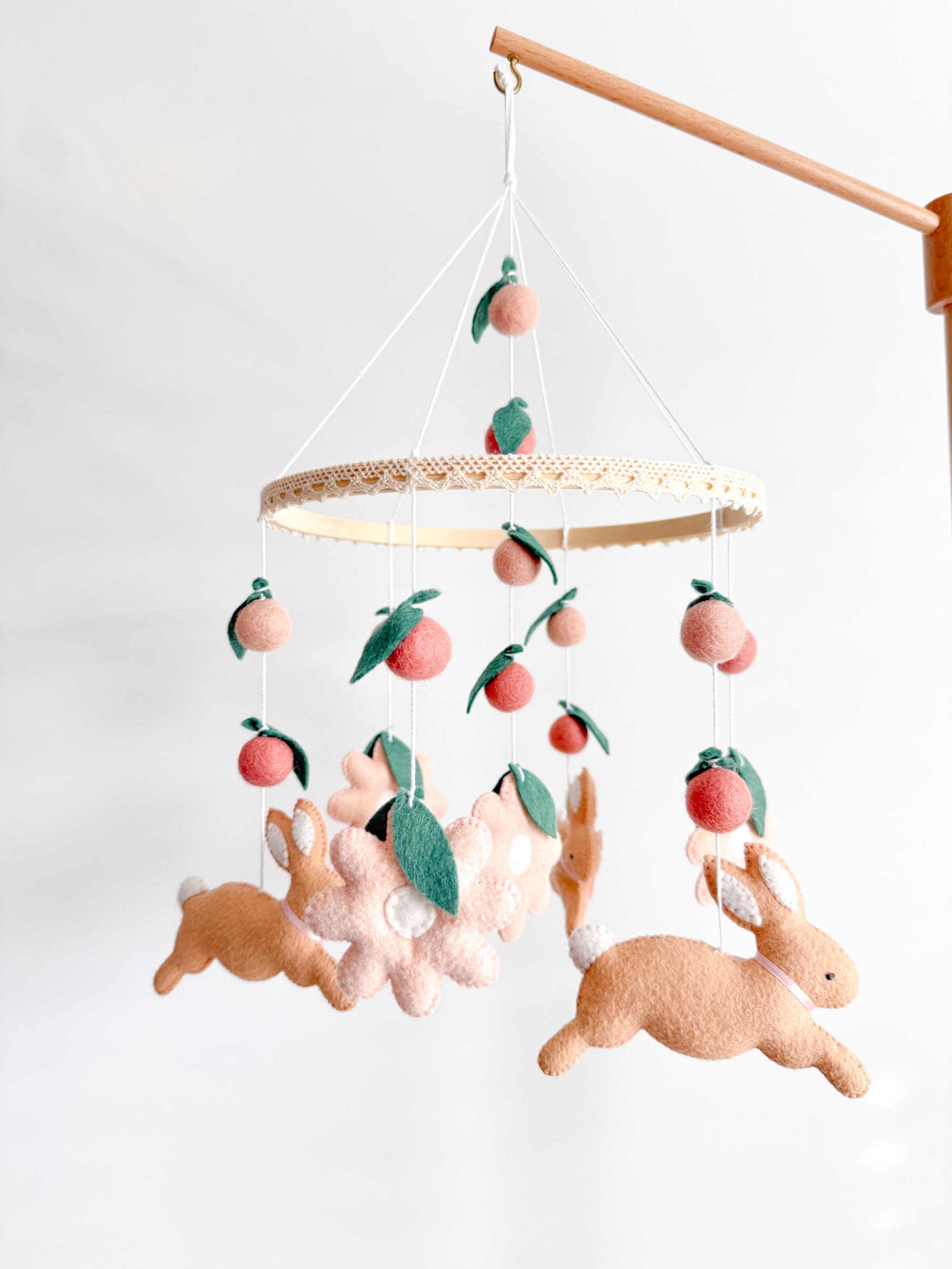 Rabbit mobile with pink flowers