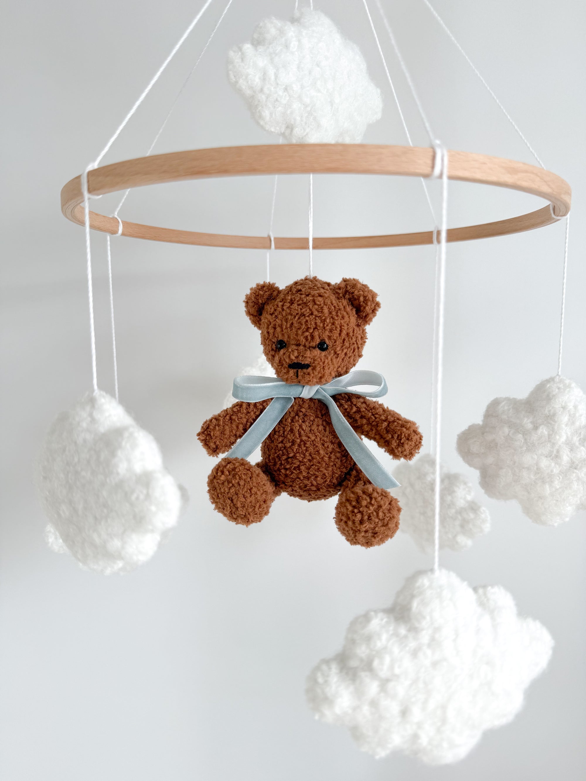 Boucle mobile with dark brown teddy bear