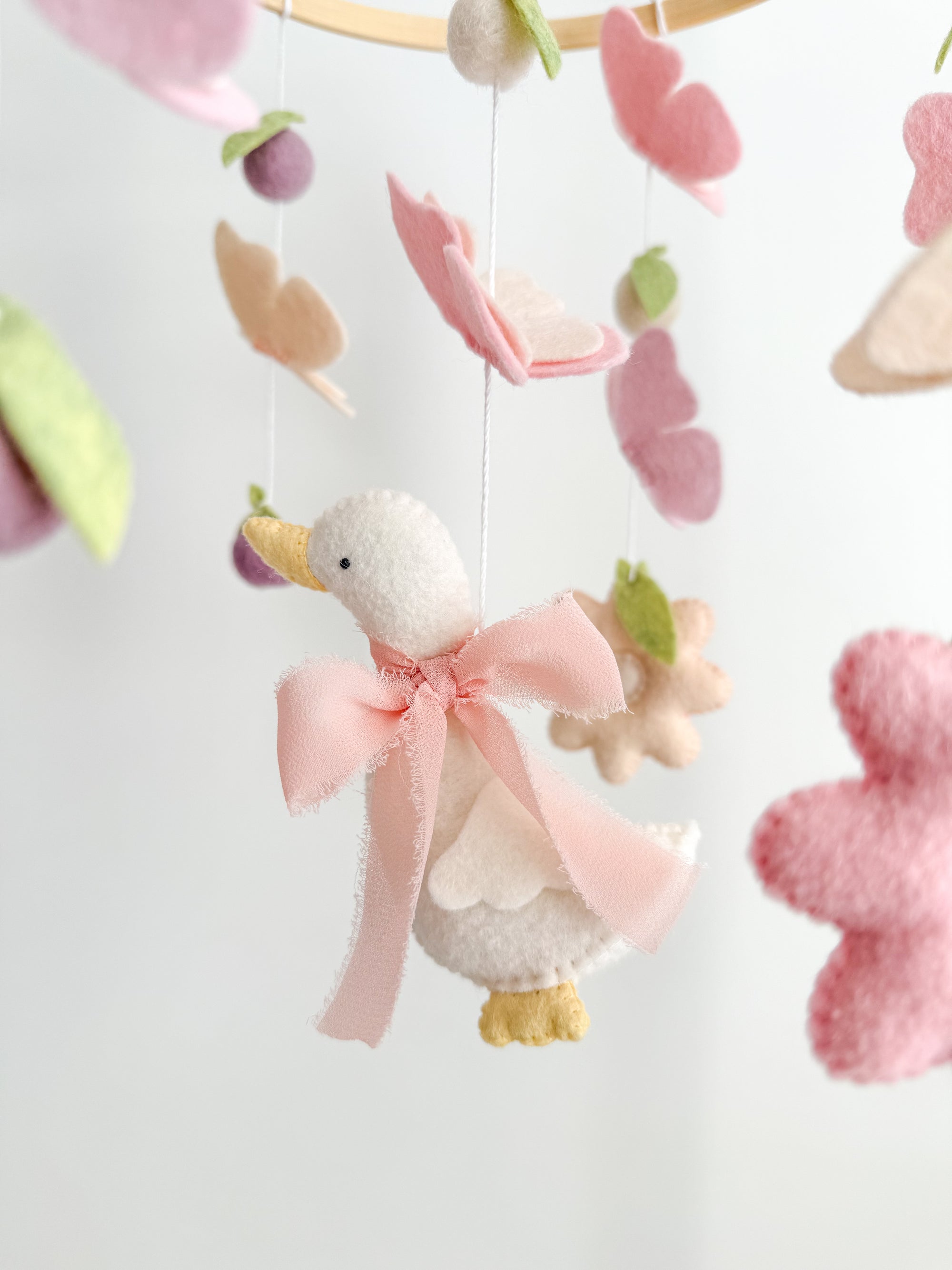 Mobile with a goose and butterflies