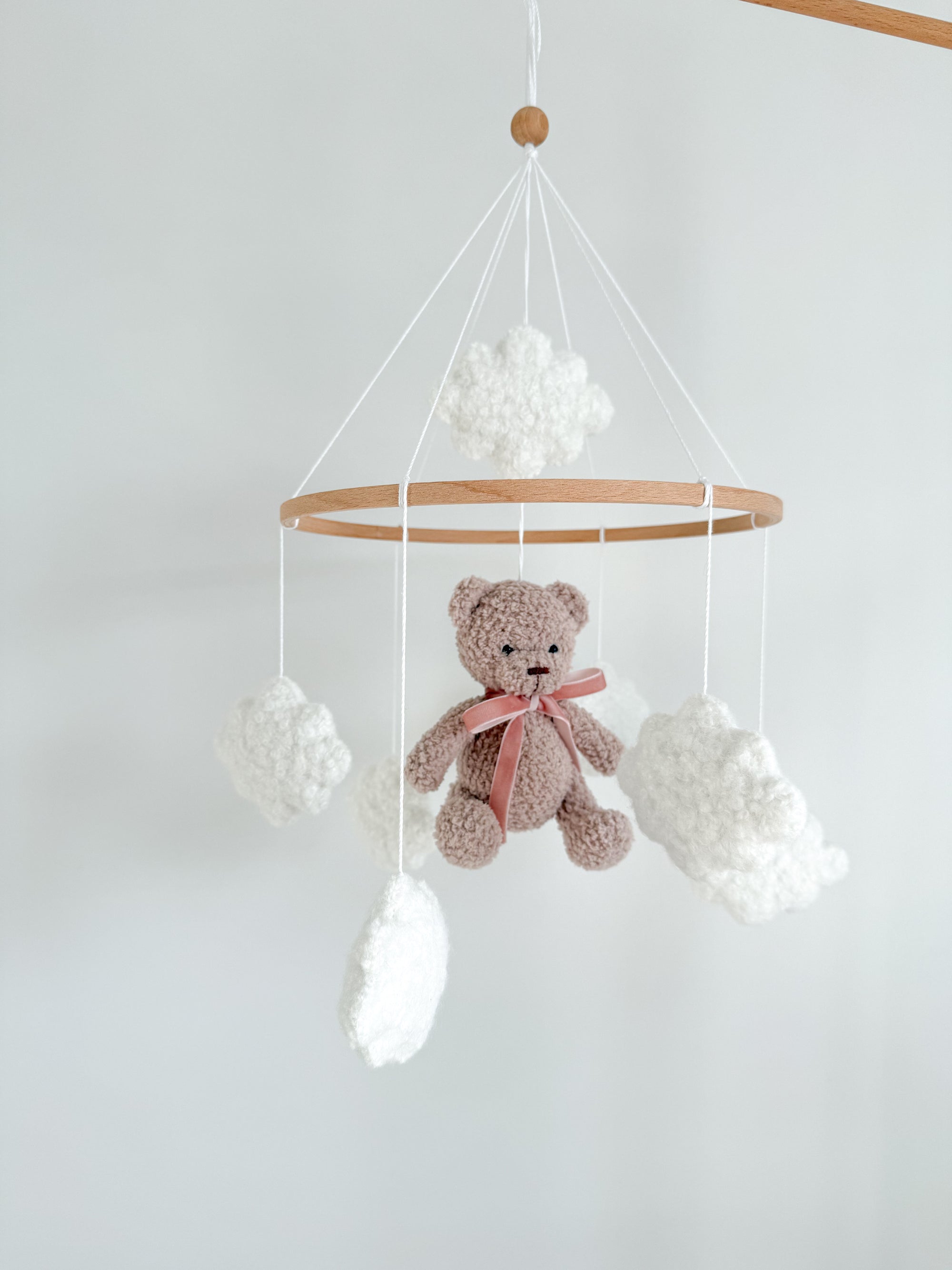 Boucle mobile with beige teddy bear