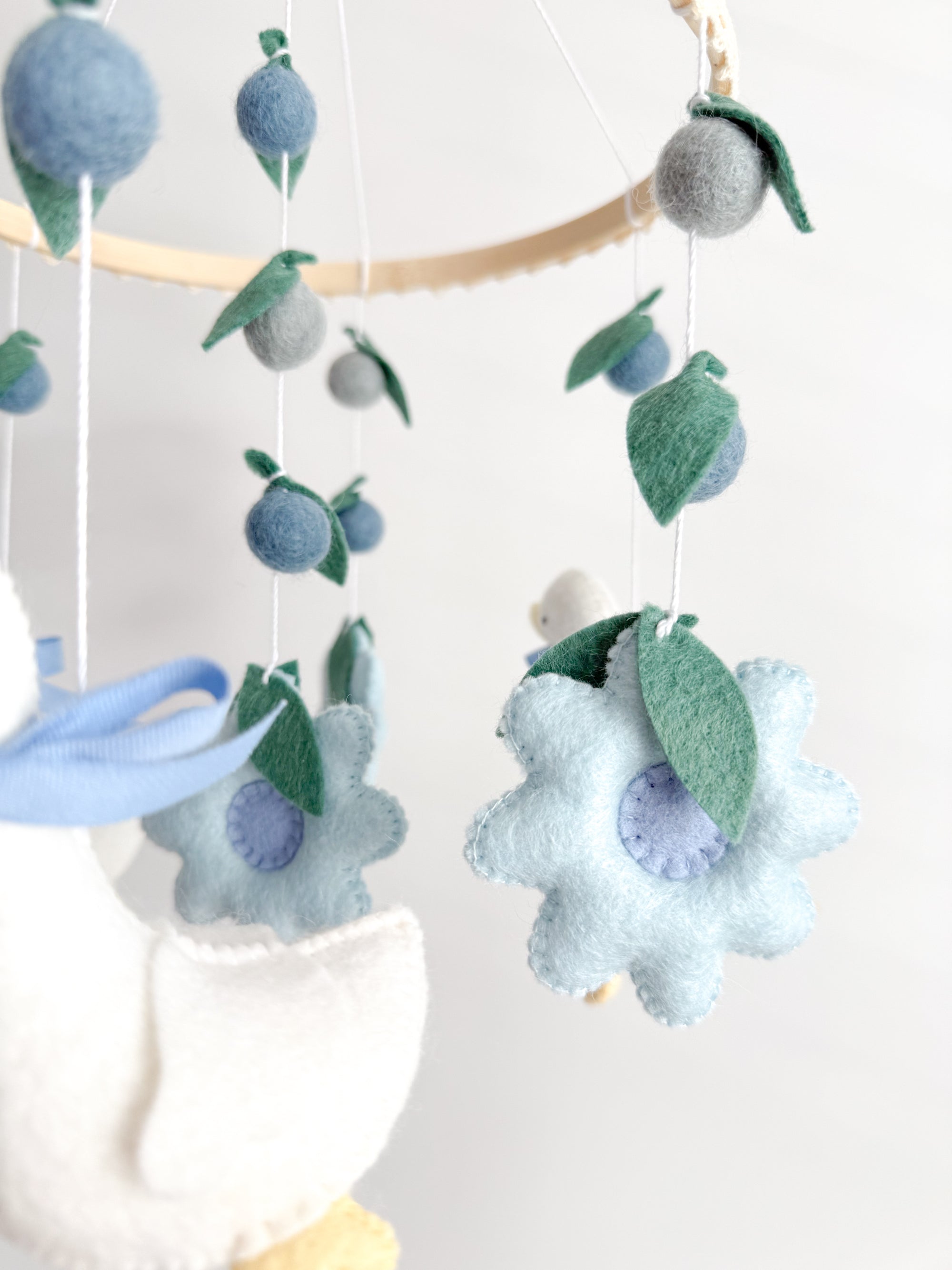 Goose mobile with blue flowers