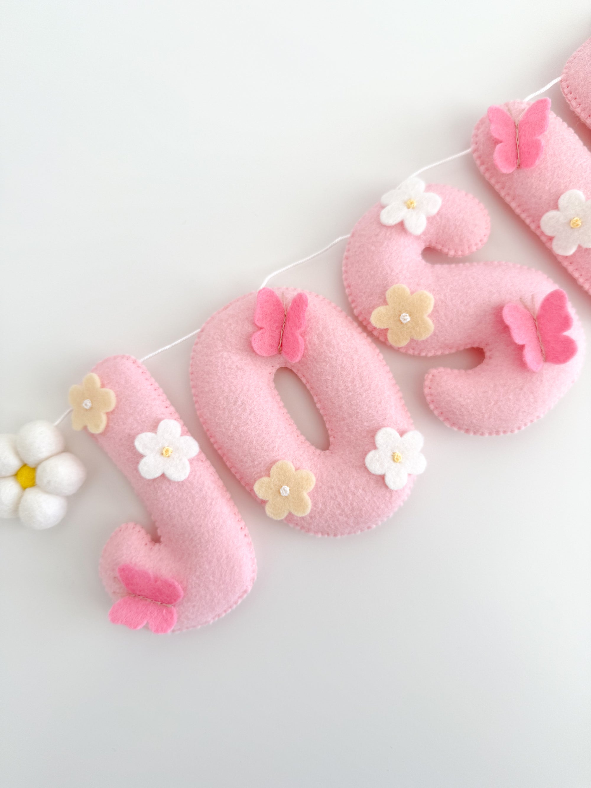 Name banner with flowers and butterflies