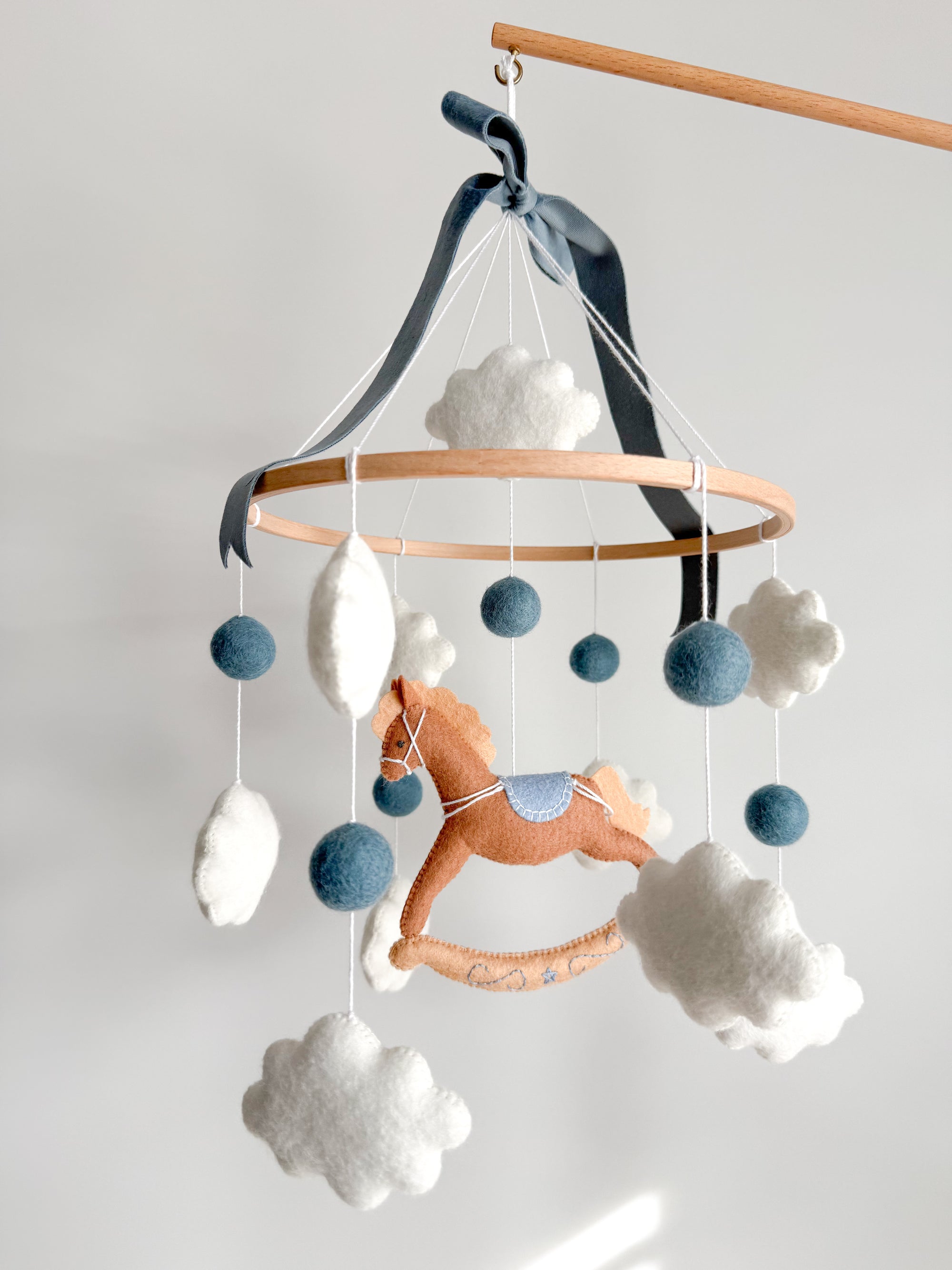 Mobile with a brown rocking horse