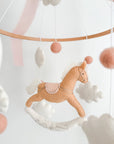 Mobile with a brown rocking horse and pink bow