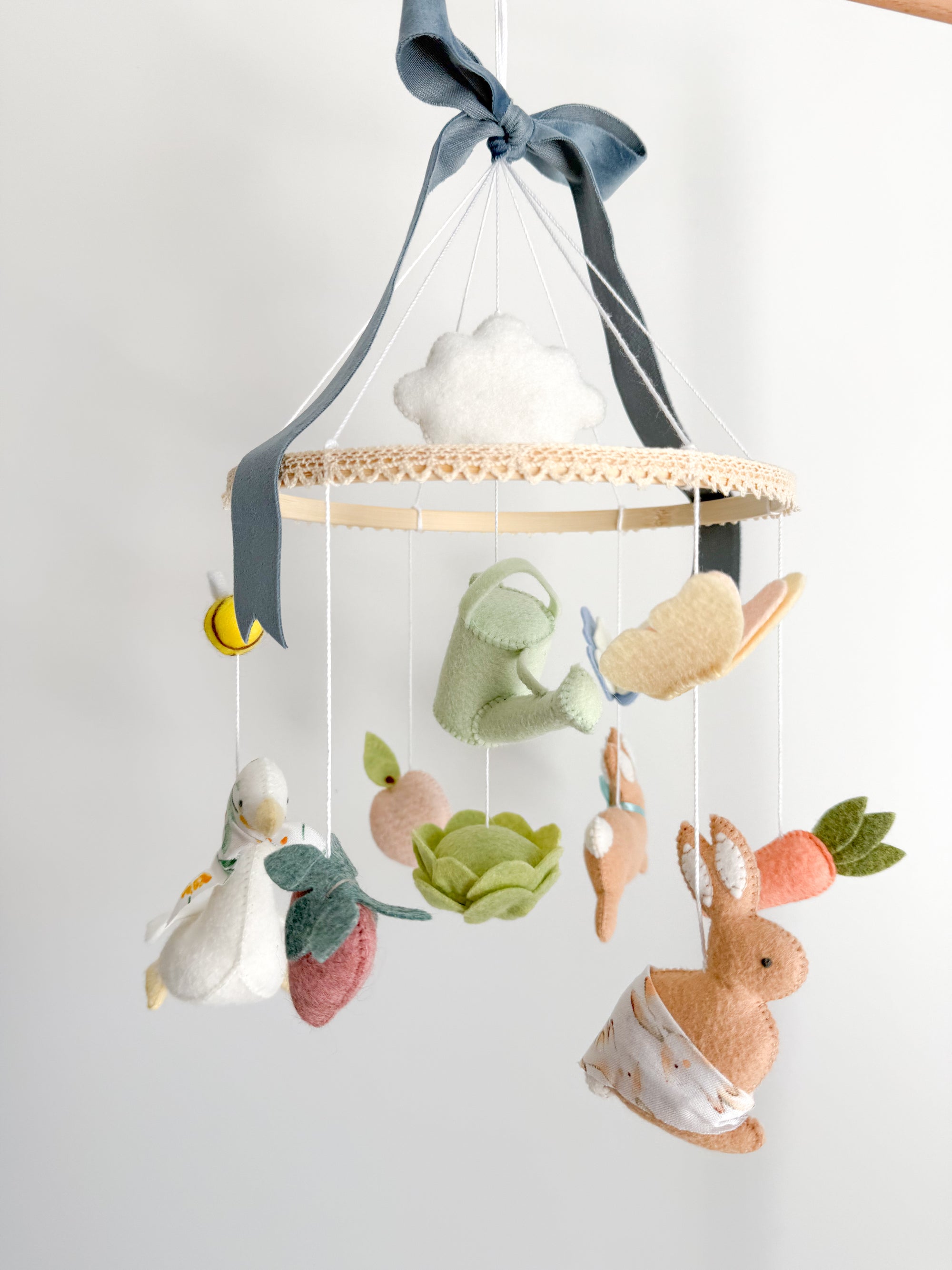 Garden rabbit mobile with blue bow